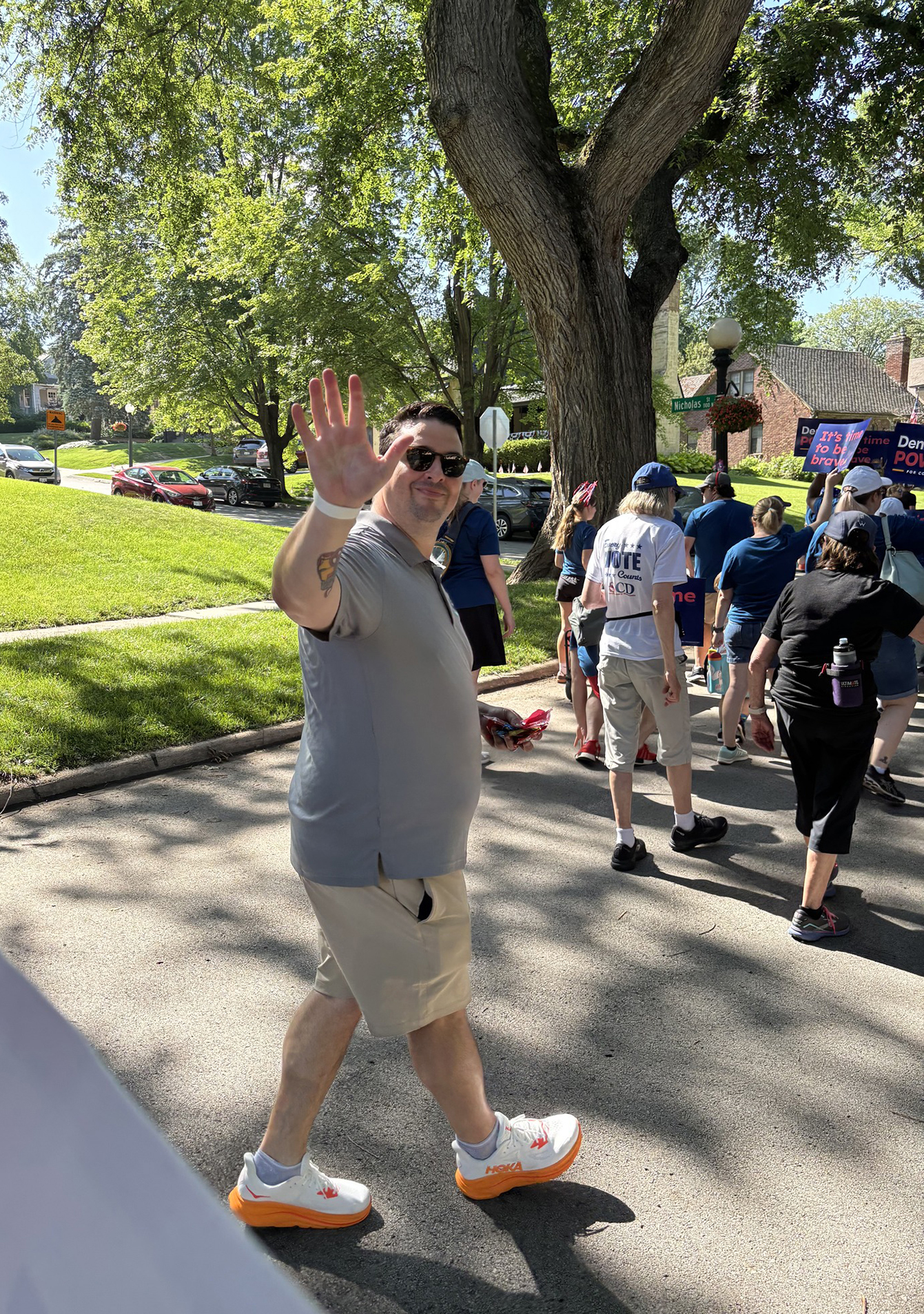 Attorney Joshua Livingston waves to the crowd during the 75th annual JE George July 4 Parade, a neighborhood tradition celebrating America and community.<br />(Courtesy of Dana Livingston)