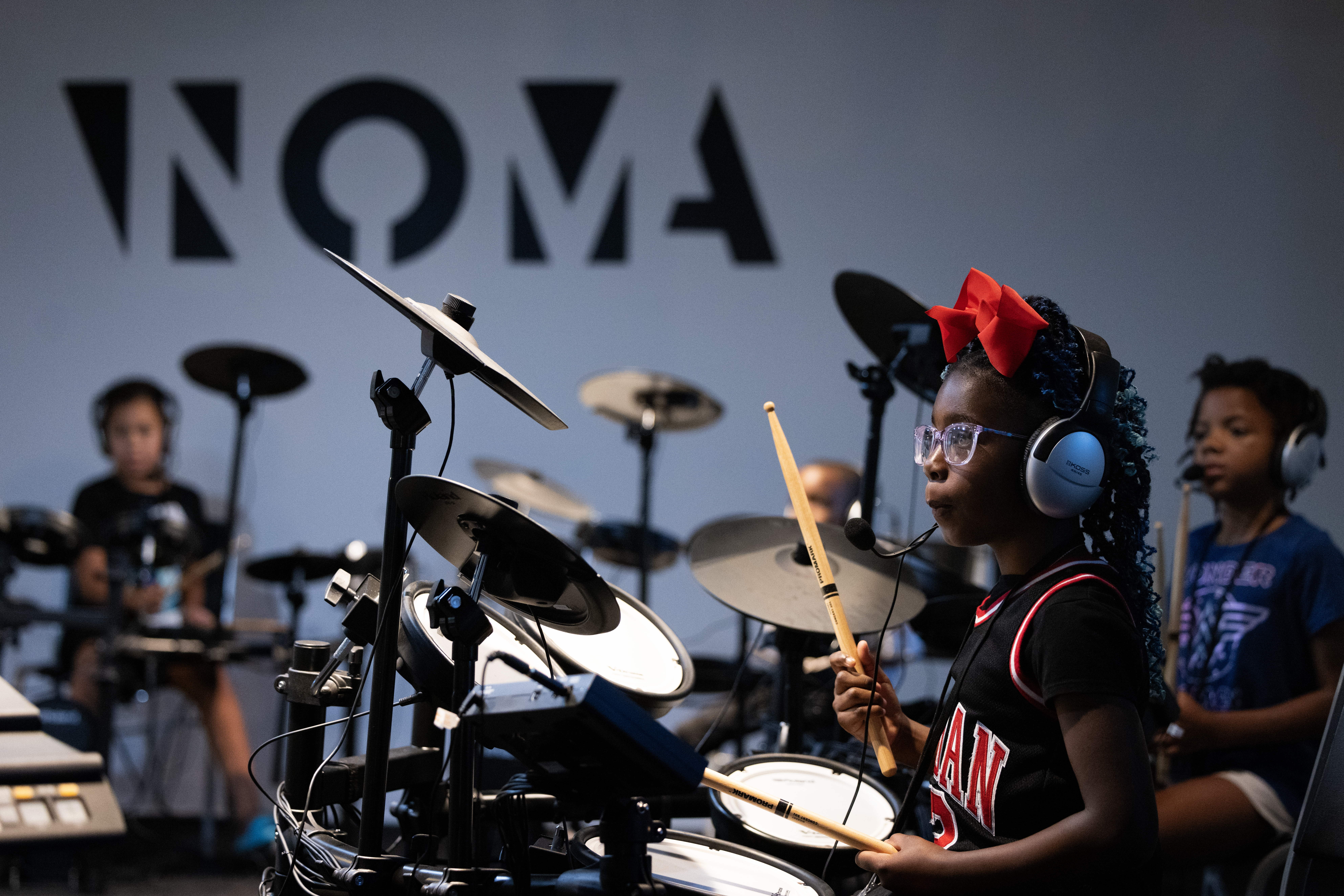Ava Hardy, 7, learns to play drums during a summer camp at North Omaha Music &amp; Arts in Omaha.<br />(Rebecca S. Gratz / Flatwater Free Press)