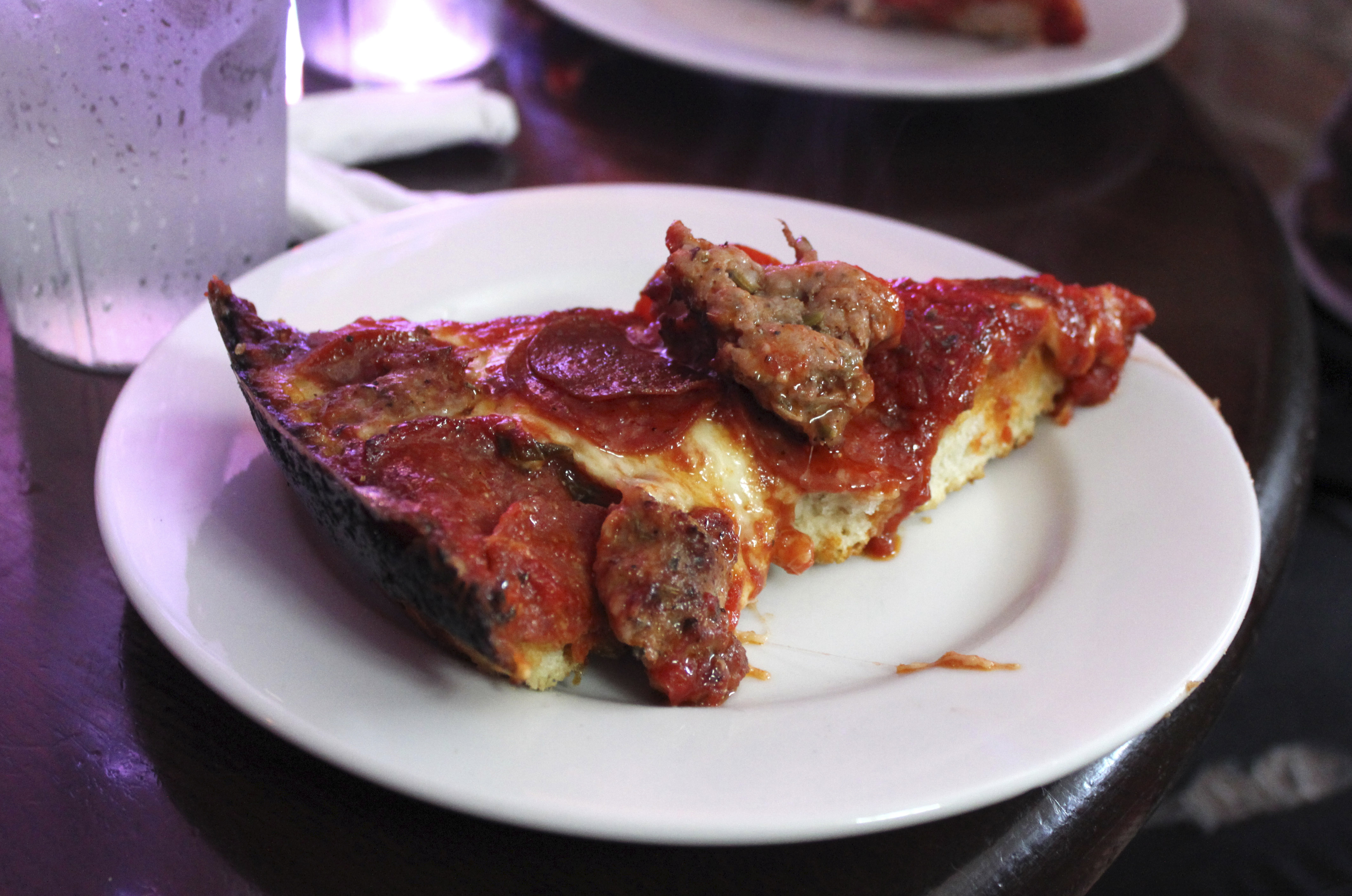 A slice of deep-dish pizza is shown at Pequod&#039;s in Chicago Sept. 5, 2014. Chicago is one of a handful of cities across the country, like Boston, Milwaukee and New York, with companies that offer tours of the local pizza scene.<br /> (Caryn Rousseau / AP Photo)