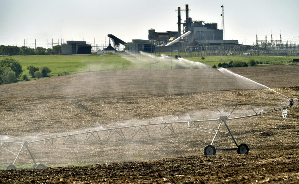 A center pivot waters a newly planted field on farm ground stretching to the north of Sheldon Station. The farmland will eventually be replaced by a new power plant.<br />(Eric Gregory / Flatwater Free Press)