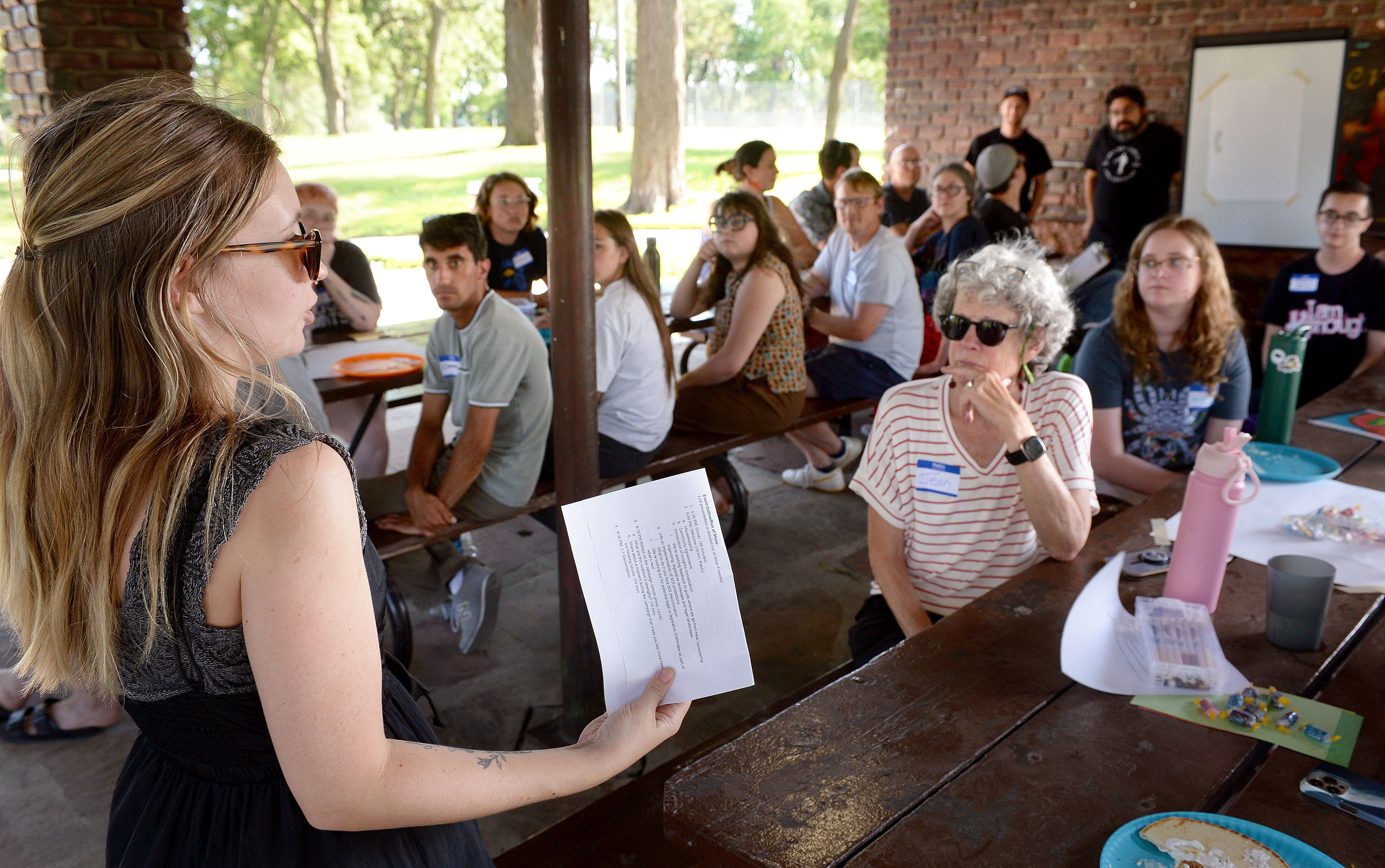 Elizabeth Engman, a Collective Impact senior community organizer, leads a conversation about next steps for Lincoln’s ban on housing discrimination based on someone’s source of income. The measure, approved by voters in May, bars landlords from rejecting rental applicants who rely on alternative sources of income, such as a Section 8 housing voucher, to pay rent.<br />(Eric Gregory / Flatwater Free Press)