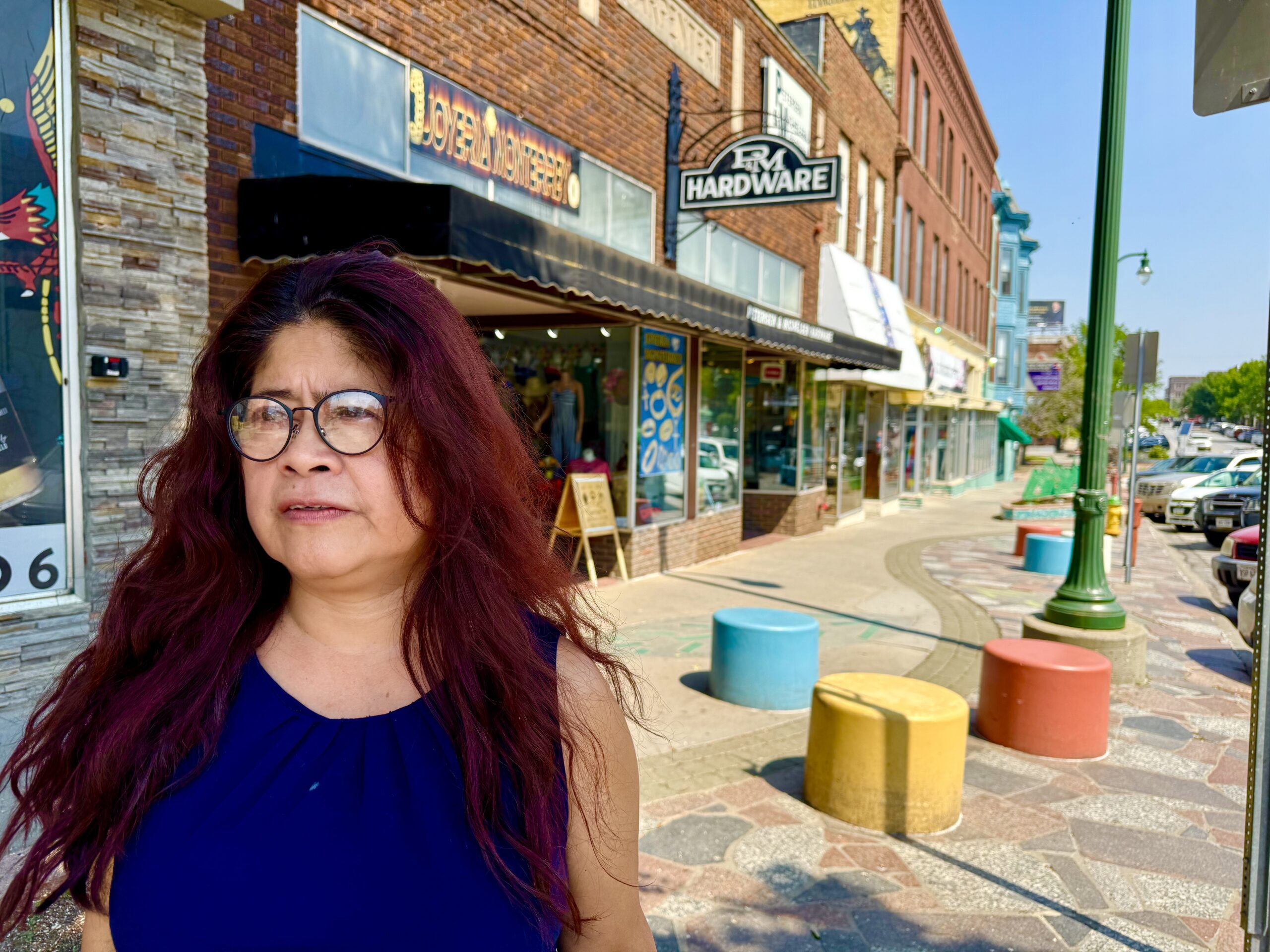 Yesenia Peck, who heads the Nebraska Hispanic Chamber, was checking on South Omaha merchants Tuesday in the wake of reports that immigration raids were unfolding.<br />(Cindy Gonzalez / Nebraska Examiner
