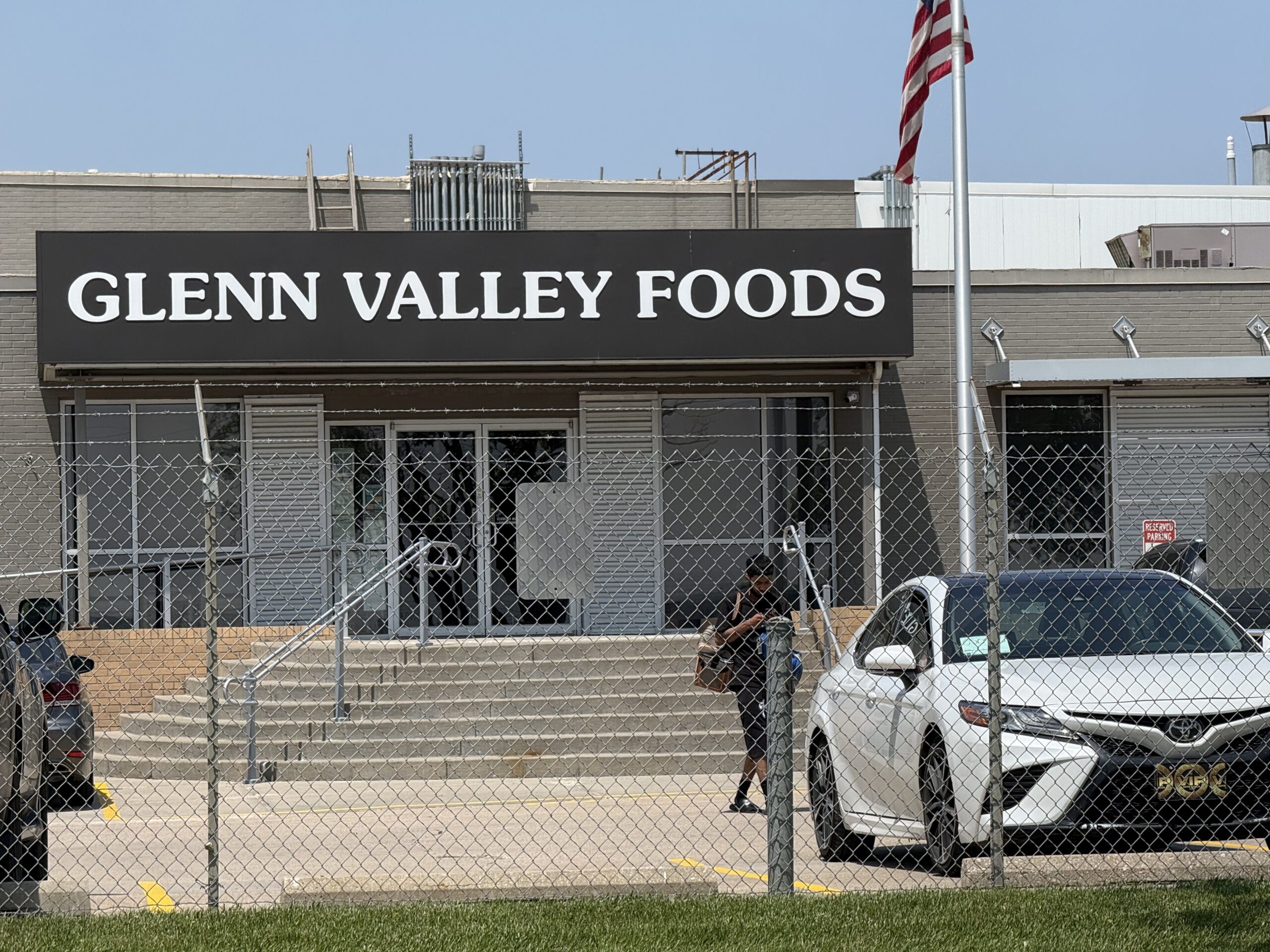 Federal immigration agents raided an Omaha food plant, Glenn Valley Foods, on Tuesday. Witnesses saw people placed into three vans and a bus.<br /> (Aaron Sanderford / Nebraska Examiner)
