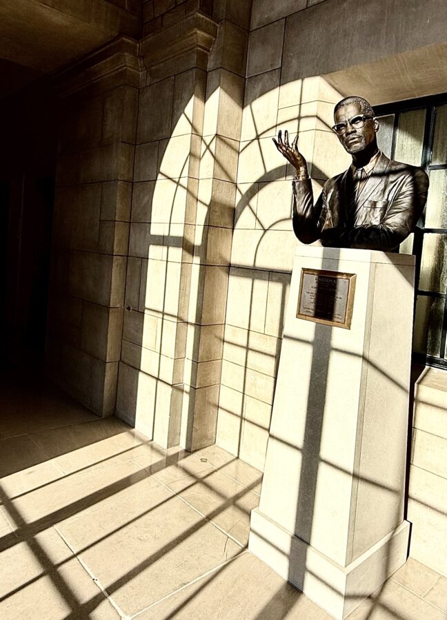 Light reflects through windows of the State Capitol and on the bust of Nebraska Hall of Fame inductee Malcolm X.<br />(Cindy Gonzalez / Nebraska Examiner)