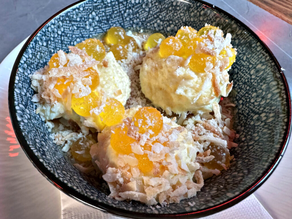 With a variety of interesting textures, the chai panna cotta is an unusual dessert, made with coconut milk, mango chantilly cream, mango popping boba balls, toasted coconut and grated halva, which is a traditional Middle Eastern sweet.<br />(Sarah Baker Hansen / Flatwater Free Press)