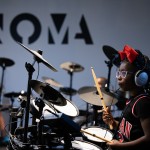 Ava Hardy, 7, learns to play drums during a summer camp at North Omaha Music & Arts in Omaha. 
(Rebecca S. Gratz / Flatwater Free Press)