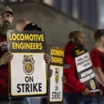 Union members from the Brotherhood of Locomotive Engineers and Trainmen form a picket line outside the NJ Transit Headquarters on Friday, May 16, 2025 in Newark, New Jersey. 
(Stefan Jeremiah / AP Photo)