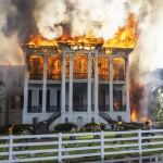 Fire crews mover a line around the now fully engulfed the Nottoway Plantation on Thursday, May 15, 2025 in White Castle, La. 
(Michael Johnson / The Advocate via AP)