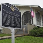 A Nebraska state historical marker acknowledging the former hospital, which will soon reopen as the Dr. Susan La Flesche Picotte Center in Walthill. Dr. Susan La Flesche Picotte was America's first Native American doctor, who then came back to Nebraska and became the sprawling Omaha Reservation’s first medical doctor. She built this hospital, the first of its kind in America. 
(Jerry L Mennenga / Flatwater Free Press)
