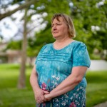 Jacque Palczynski, the mother of a son who struggles with a serious mental illness, poses for a photo June 6. Palczynski has tried several times to commit her son and force him to receive treatment for his schizoaffective disorder. But the safety net in Douglas County has not helped, she said, which has led her son to cycling in and out of hospitals and jail. 
(Abiola Kosoko / Flatwater Free Press)