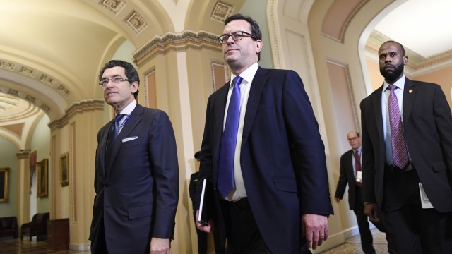 House Democrat attorneys Norm Eisen (left) and Barry Berke (center) arrive on the Senate side of Capitol Hill in Washington, Monday, Feb. 3, 2020, for the impeachment trial of President Donald Trump. 
(Susan Walsh / AP Photo)
