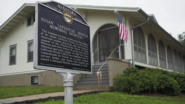 A Nebraska state historical marker acknowledging the former hospital, which will soon reopen as the Dr. Susan La Flesche Picotte Center in Walthill. Dr. Susan La Flesche Picotte was America's first Native American doctor, who then came back to Nebraska and became the sprawling Omaha Reservation’s first medical doctor. She built this hospital, the first of its kind in America. 
(Jerry L Mennenga / Flatwater Free Press)
