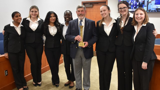 Nebraska State Bar Foundation President Stephen S. Gealy, stands with Duchesne Academy team members, state champions of the 2025 Judge Lyle Strom High School Mock Trial competition. The Omaha team will compete for the national championship to be held May 7-9, 2026, in Des Moines.
(Carla Chance / The Daily Record)