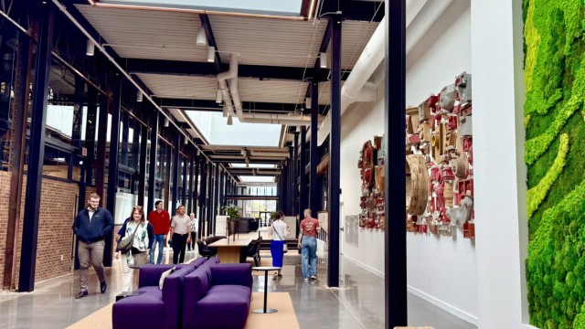 The Catalyst adaptive reuse project in midtown Omaha is to get an award at this year’s CRE Summit. Shown here is a corridor of the co-working hub, which used to be an alleyway on an old steel plant campus. The building is expected to be a magnet for innovative health care businesses. 
(Cindy Gonzalez / Nebraska Examiner)