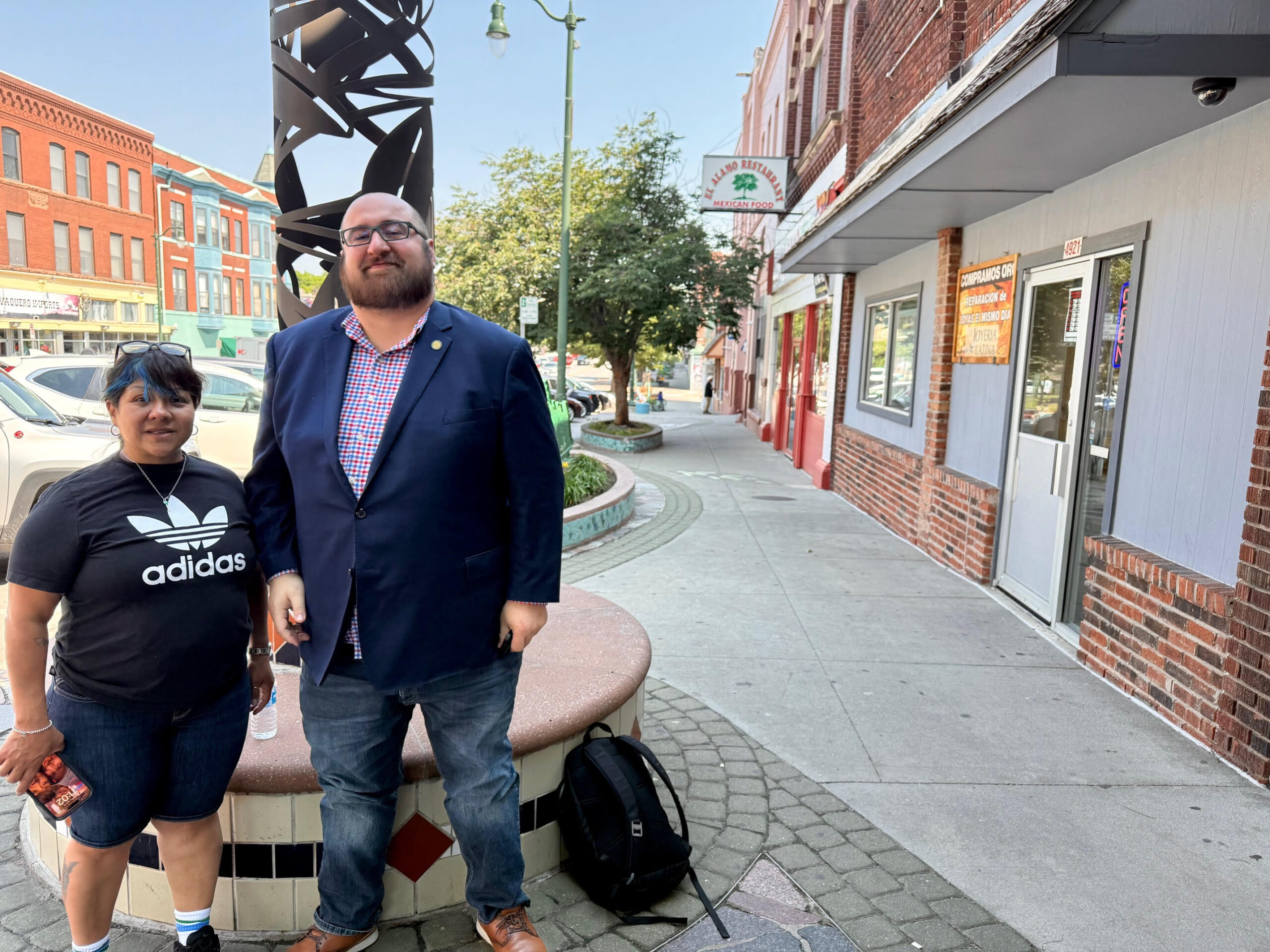 State Sen. Dunixi Guereca of South Omaha stands along South 24th Street with business owner Martha Barrera and discuss the federal immigration enforcement operation that had people and businesses talking on Tuesday.<br />(Cindy Gonzalez / Nebraska Examiner)