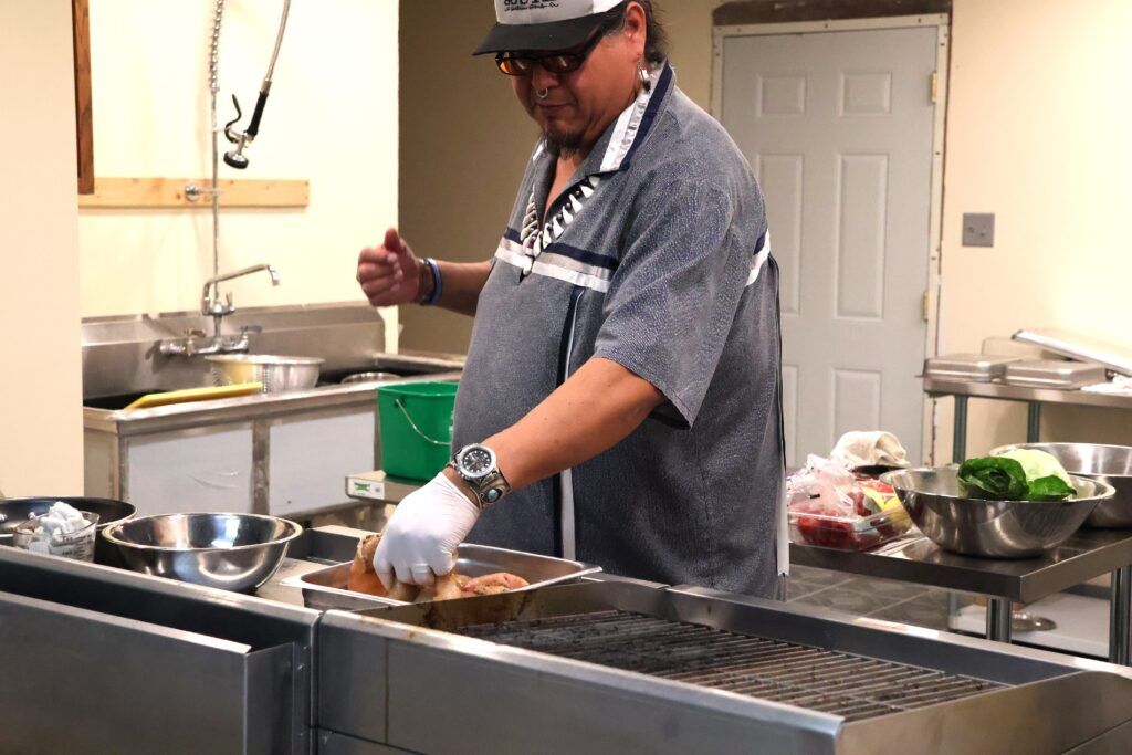 Anthony Warrior discusses the nutritional benefits of cooking corn husks.<br />(Tim Trudell / Flatwater Free Press)