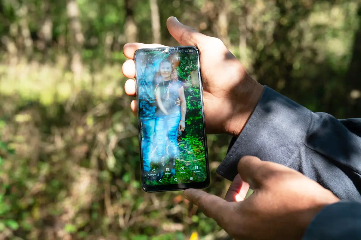 Ariel shows a photo of himself with his wife, Maricela.<br />(Sofia Aldinio / ProPublica)
