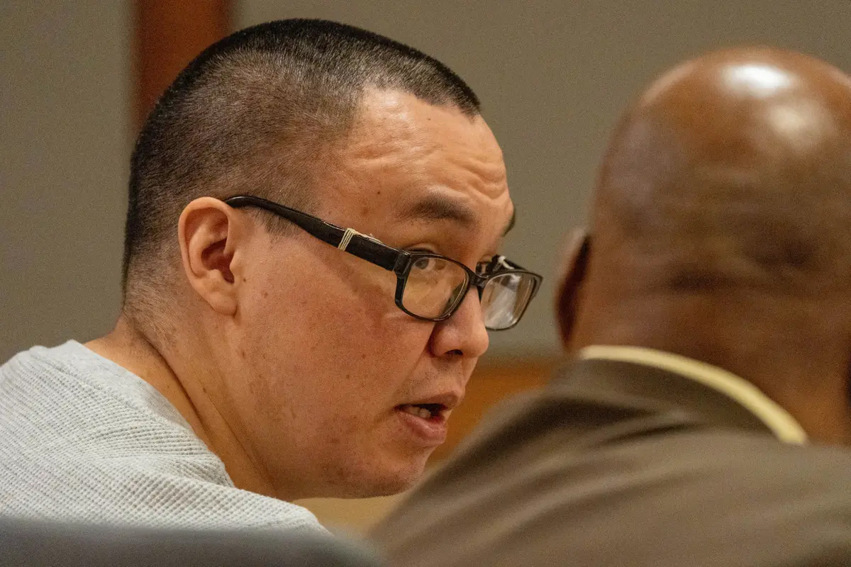 Fred Tom Hurley III talks with his attorney, Rex Butler, during his trial.<br />(Loren Holmes / Anchorage Daily News)