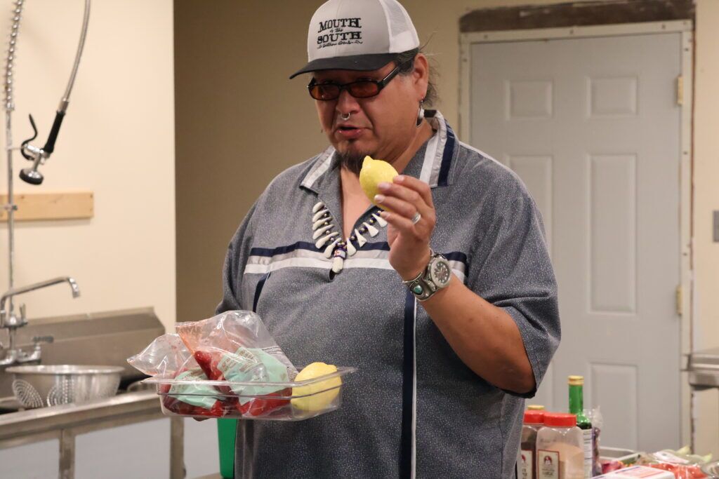 Chef Anthony Warrior shares ingredients for a chicken and berry salad.<br />(Tim Trudell / Flatwater Free Press)