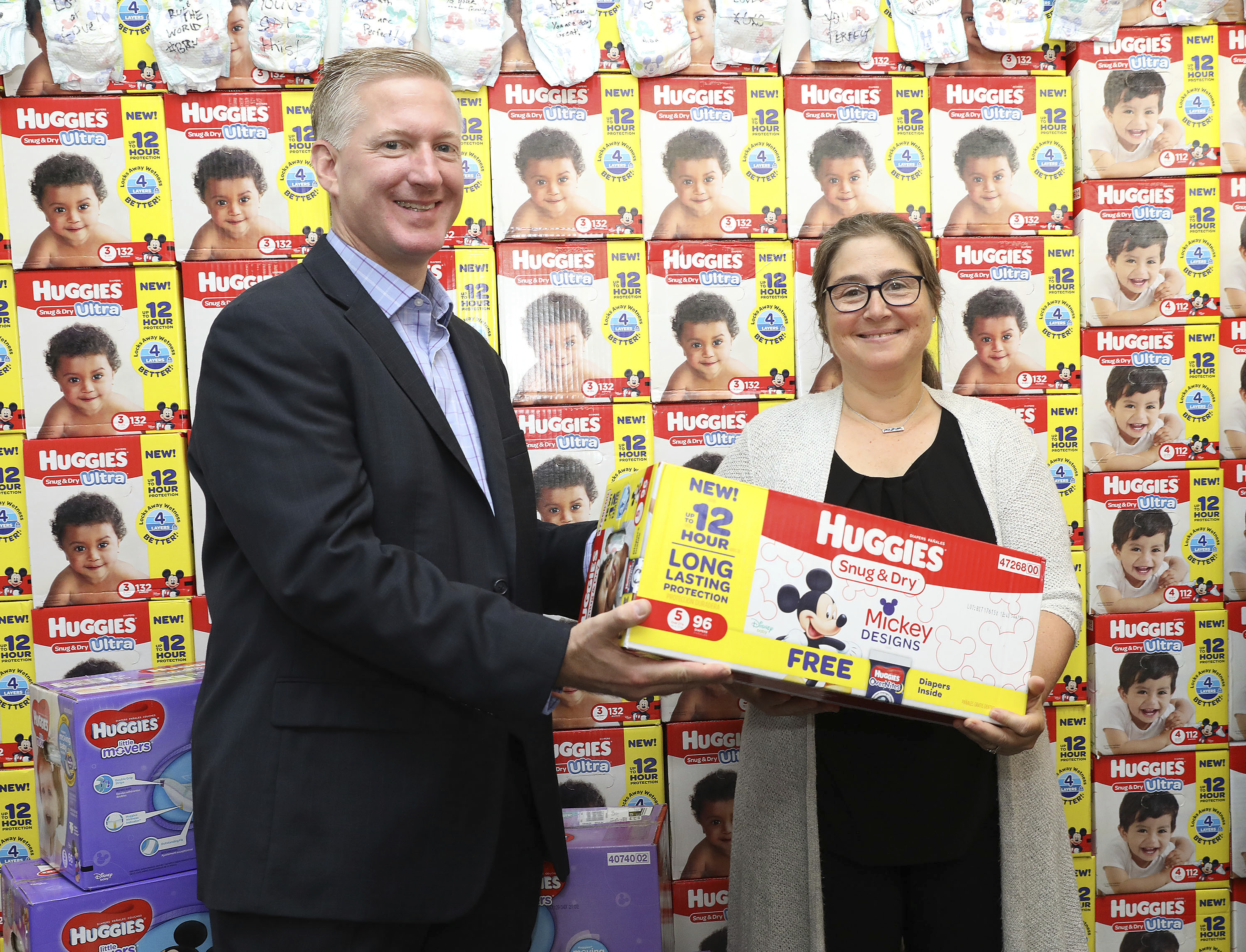Joanne Samuel Goldblum, CEO of the National Diaper Bank Network, accepts a donation of 1.5 million diapers from Babies&quot;R&quot;Us and Huggies No Baby Unhugged, represented by Aric Melzl, General Manager of Huggies Healthcare at Kimberly-Clark at GOOD+ Foundation on Tuesday, Sept. 26, 2017, in New York. A portion of the donation (500,000 diapers) went to GOOD+ Foundation, an NDBN member.<br />(Amy Sussman / AP Images for Huggies)