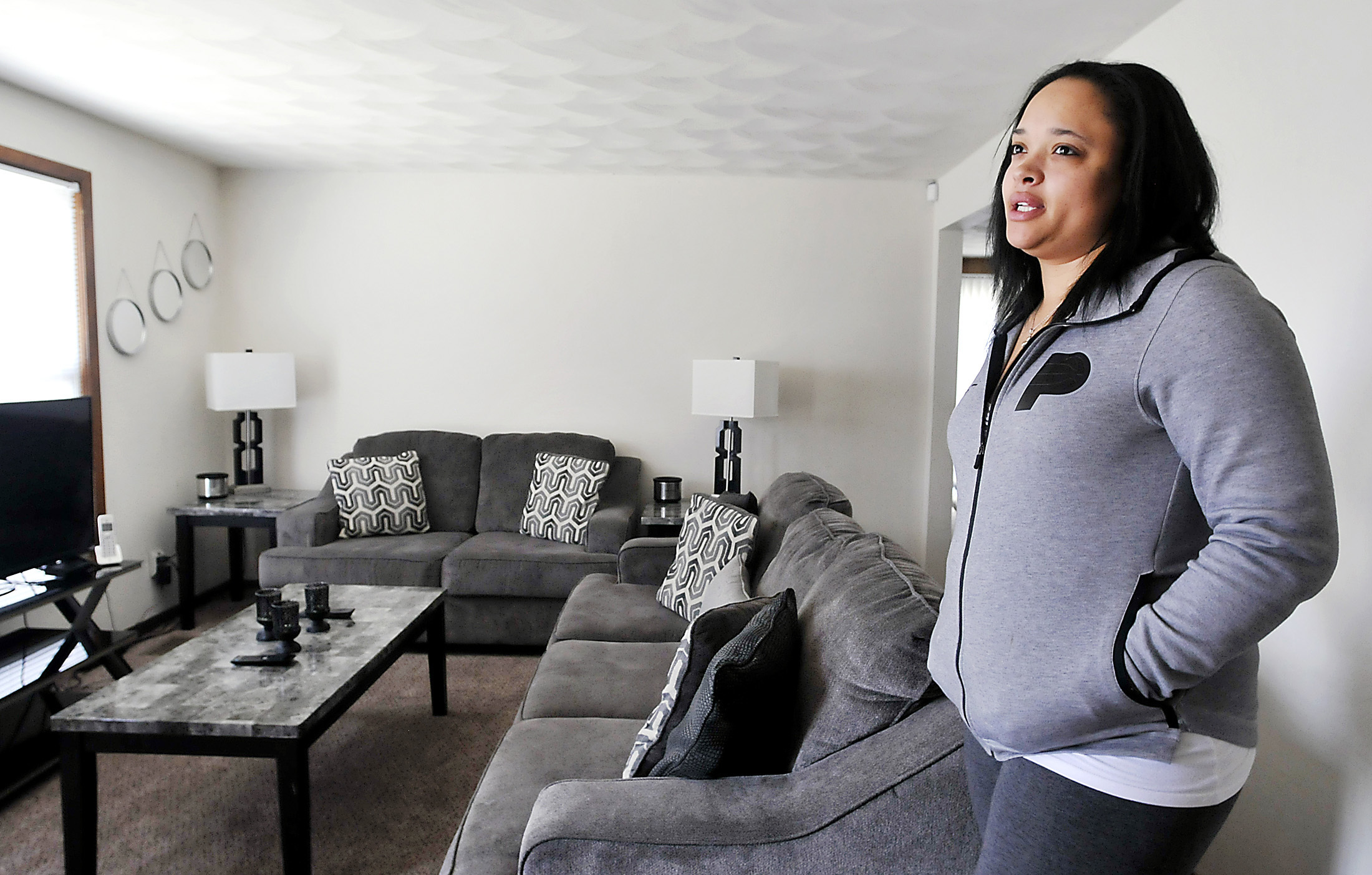 Erika Morgan is thankful for the Tenant Based Rent Assistance program, administered by the Anderson Community Development Department, that helped her, and her eight children, move into a three-bedroom house of her own.<br />(John P. Cleary / The Herald-Bulletin via AP)