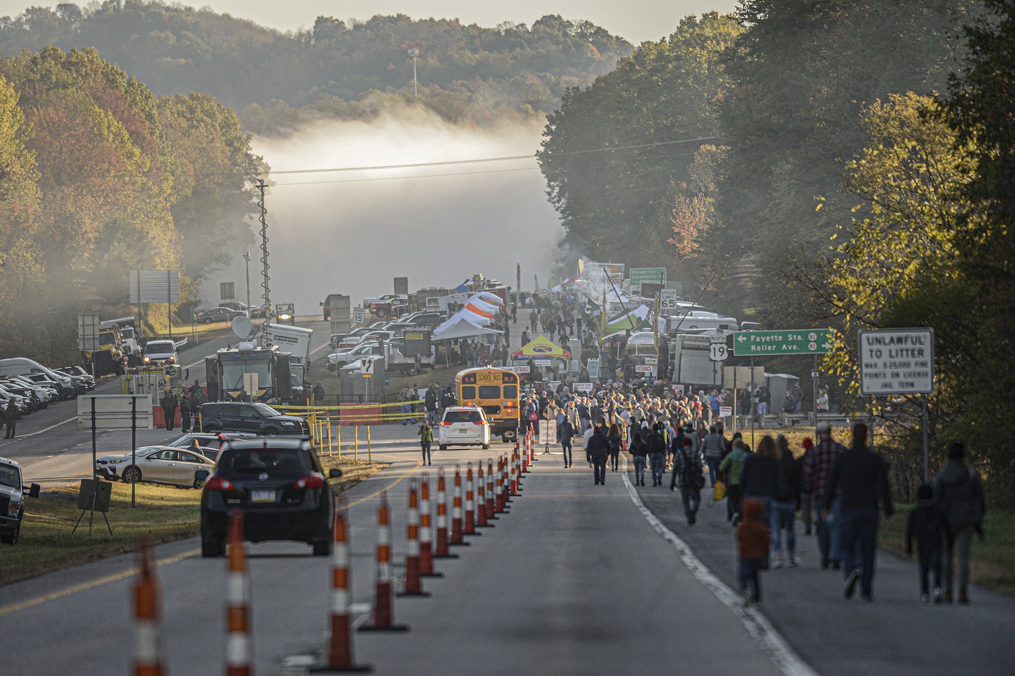 Fog covers the New River Gorge Bridge as people make their way to the annual Bridge Day festival in Fayetteville, WVa., on Saturday Oct. 19, 2019. The New River Gorge is the site of the annual Bridge Day festival, where many gather to watch people base jump into the gorge. The river became New River Gorge National Park and Preserve in 2020.<br />(F. Brian Ferguson / Charleston Gazette-Mail via AP)