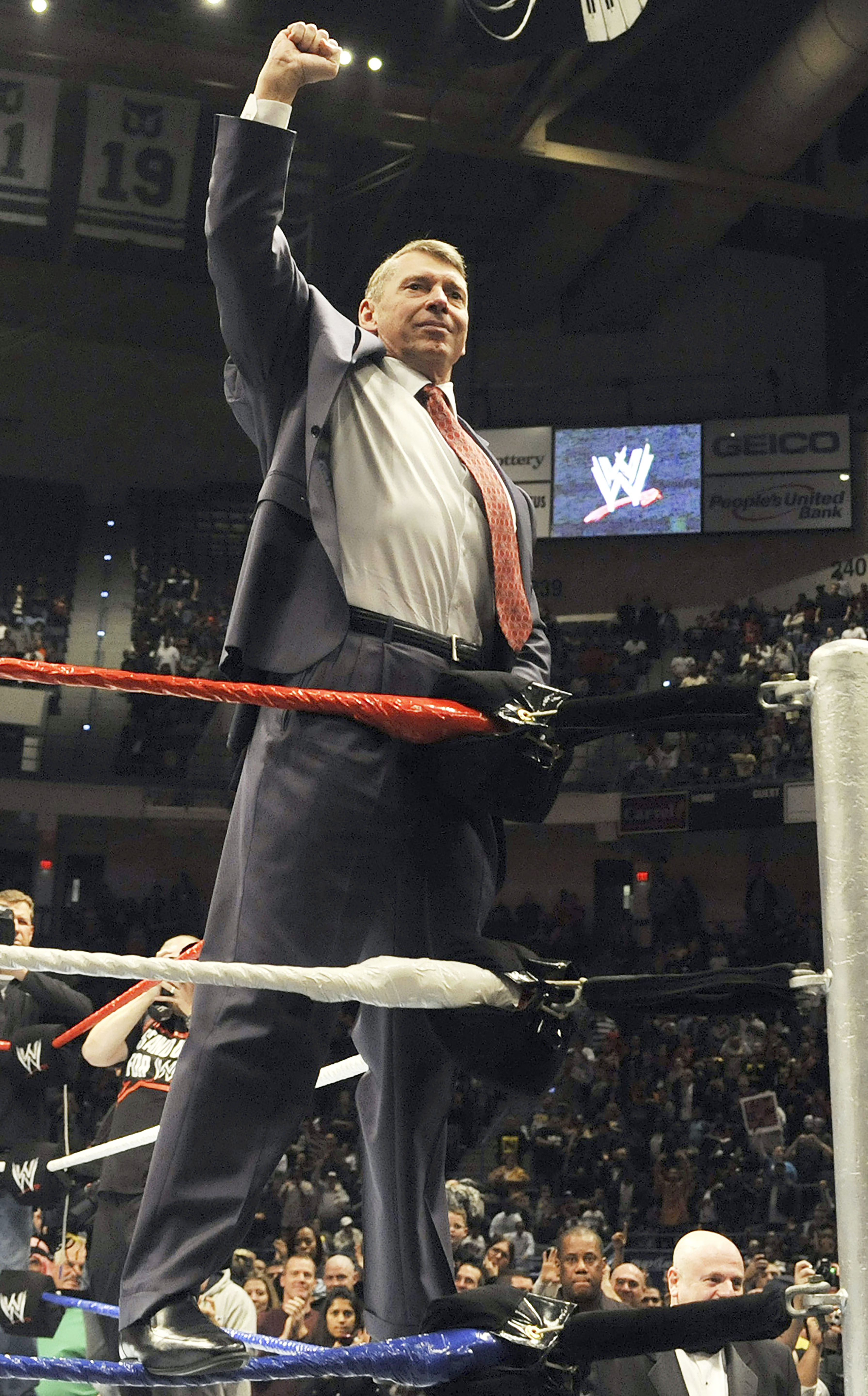 In this Oct. 30, 2010 photo, World Wrestling Entertainment chairman Vince McMahon raises his arm in the air to the audience during a fan appreciation event in Hartford, Conn. A federal appeals court on Wednesday, Sept. 9, 2020, dismissed a lawsuit filed by 50 former professional wrestlers, who claimed WWE failed to protect them from repeated head trauma including concussions that led to long-term brain damage.<br />(Jessica Hill / AP Photo)