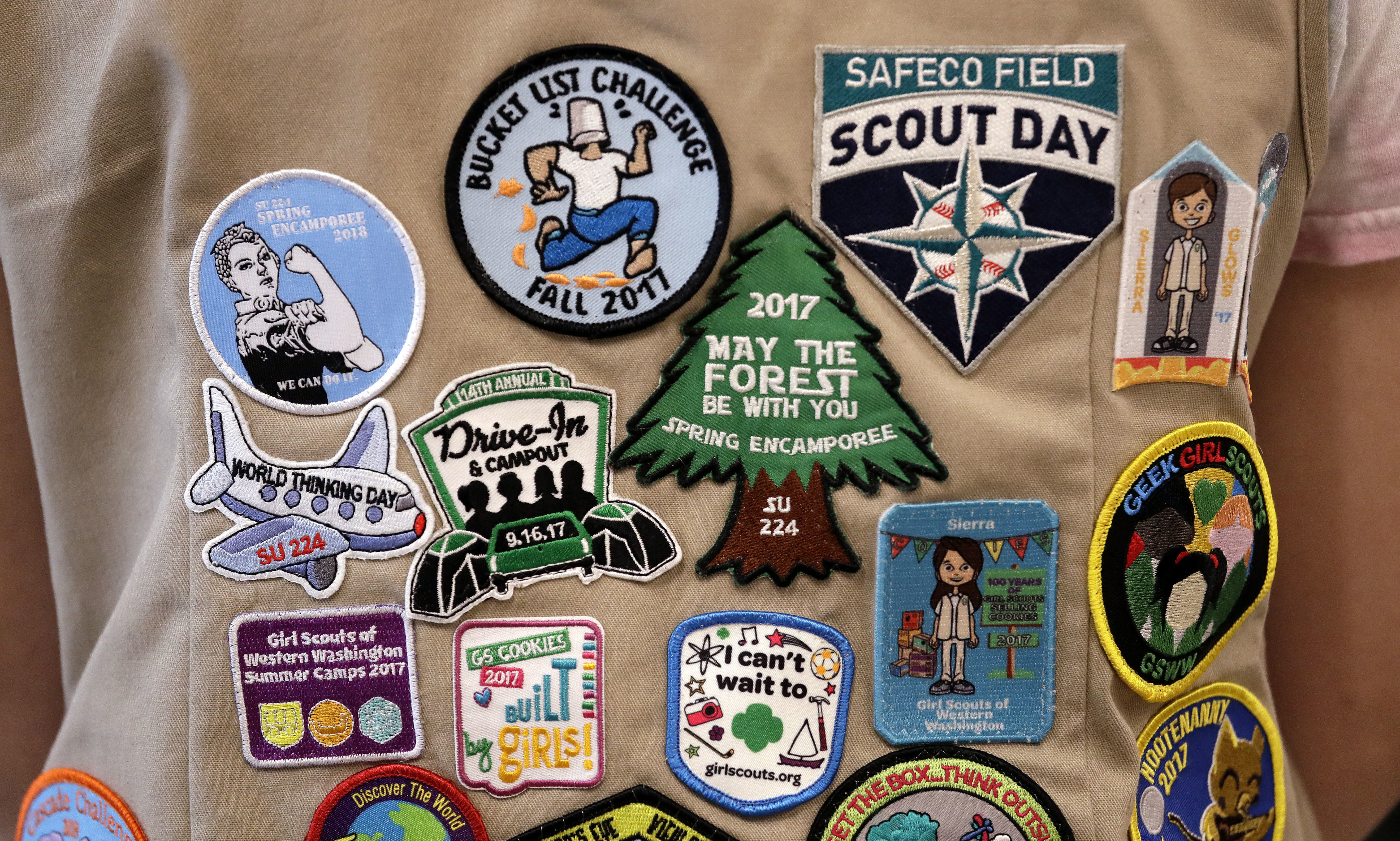 Patches cover the back of a Girl Scout’s vest at a demonstration of some of their activities in Seattle, Wash. June 18, 2018. (Elaine Thompson / AP Photo)