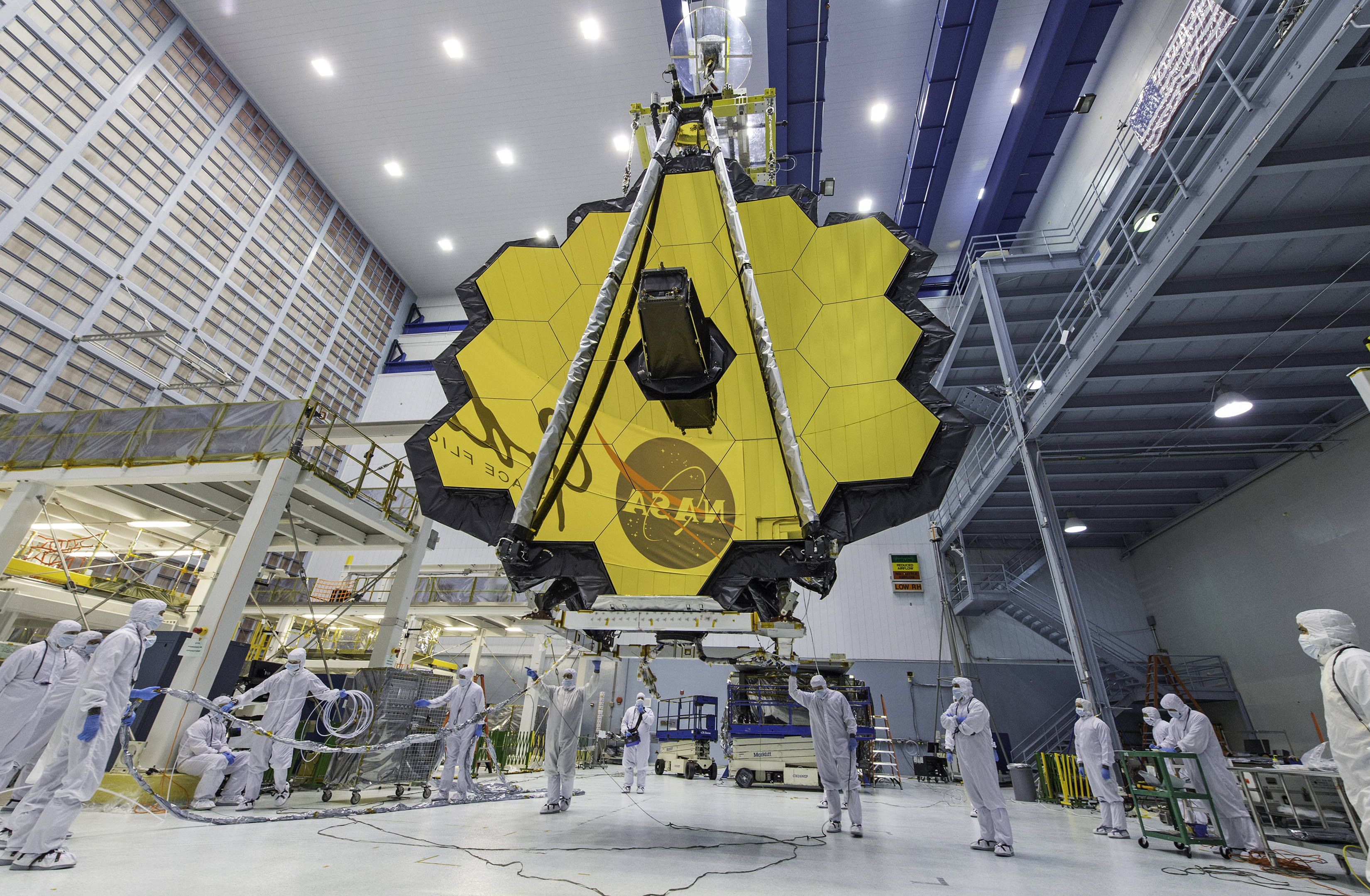 In this April 13, 2017 photo provided by NASA, technicians lift the mirror of the James Webb Space Telescope using a crane at the Goddard Space Flight Center in Greenbelt, Md. (Laura Betz / NASA via AP)
