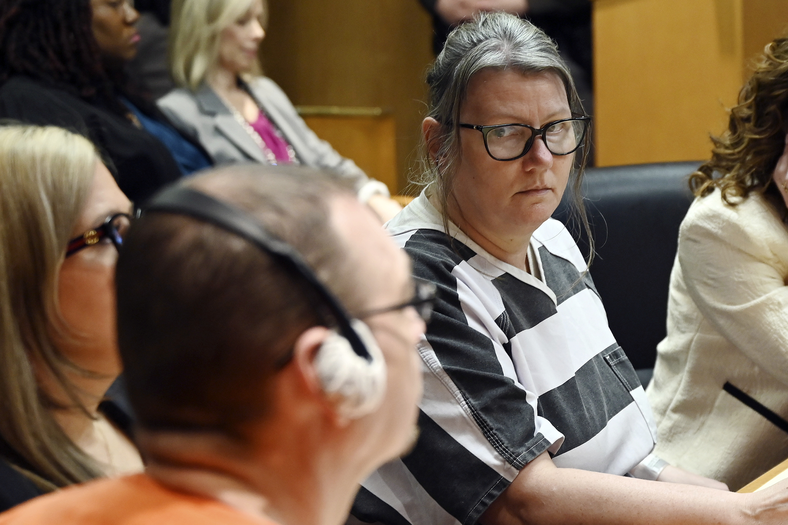 Jennifer Crumbley stares at her husband James Crumbley during sentencing.<br />(Clarence Tabb Jr. / Detroit News via AP)