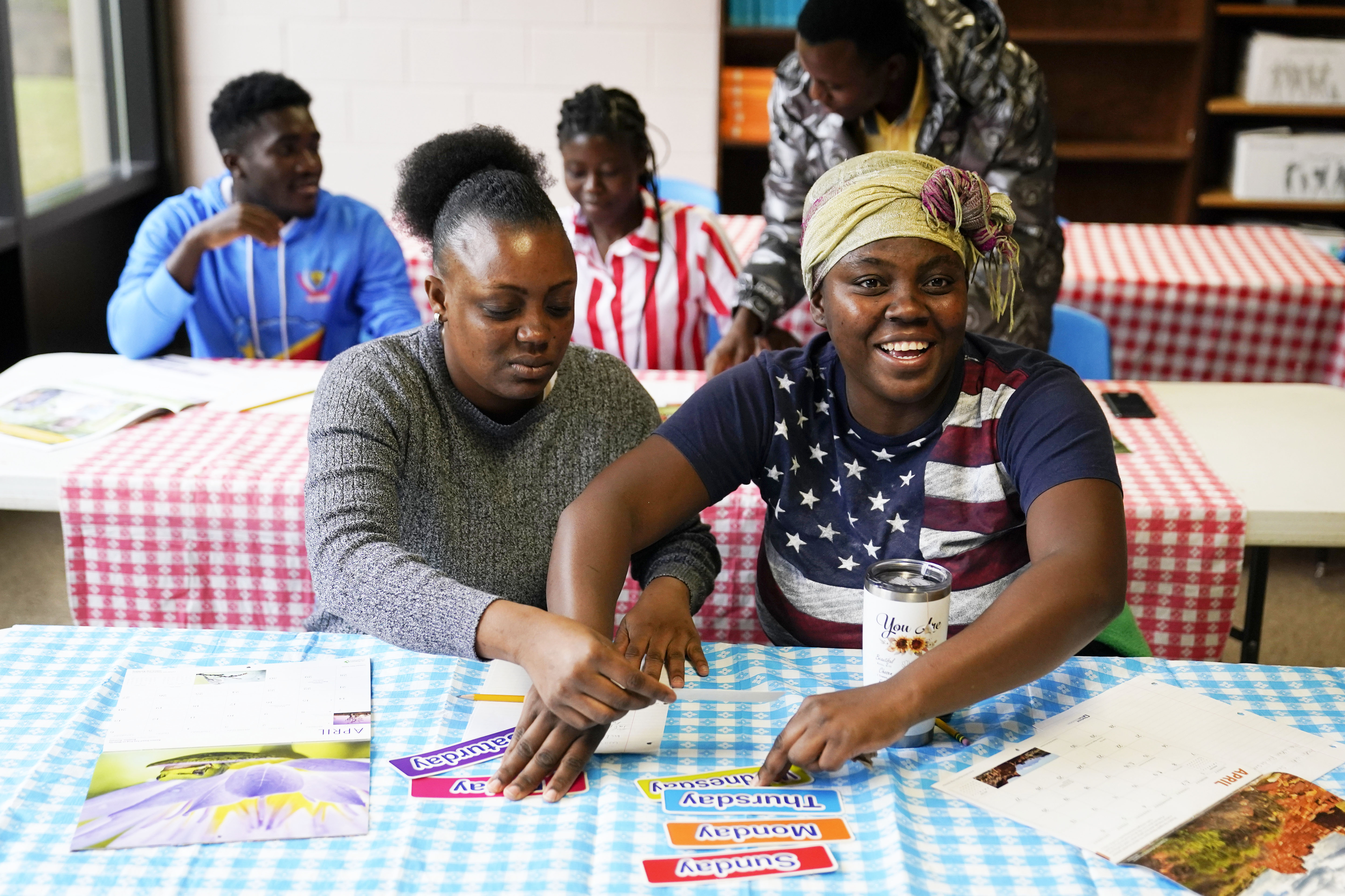 Leliz Bonilla Castro, left, and her sister Xochina Michelle Castro, refugees from Honduras, participate in an English class, Thursday, April 11, 2024, in Columbia, S.C. The American refugee program, which long served as a haven for people fleeing violence around the world, is rebounding from years of dwindling arrivals under former President Donald Trump.<br />(Erik Verduzco / AP Photo)