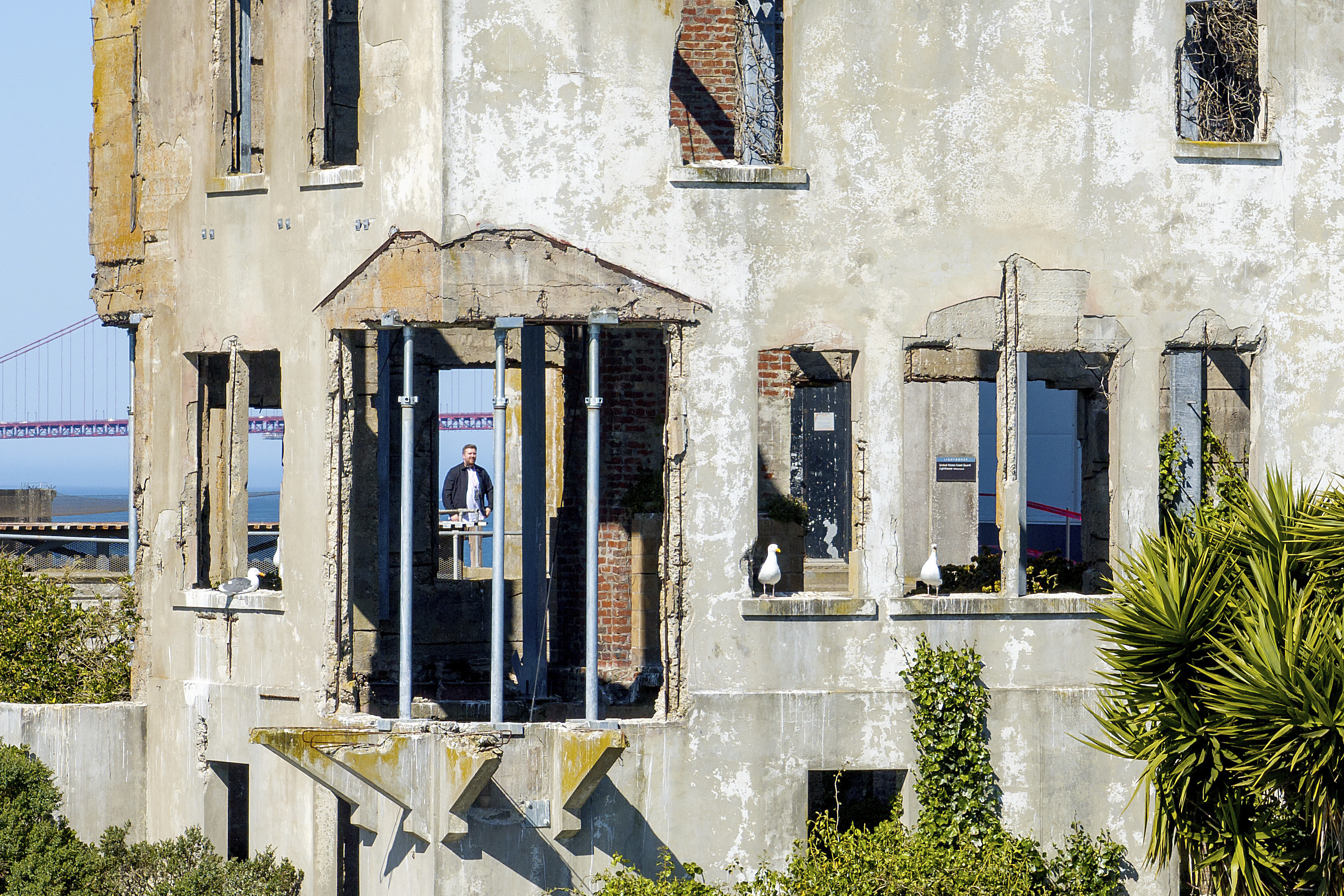 A visitor looks at the warden&#039;s house at Alcatraz Island on Monday, May 5, 2025, in San Francisco.<br />(Noah Berger / AP Photo)