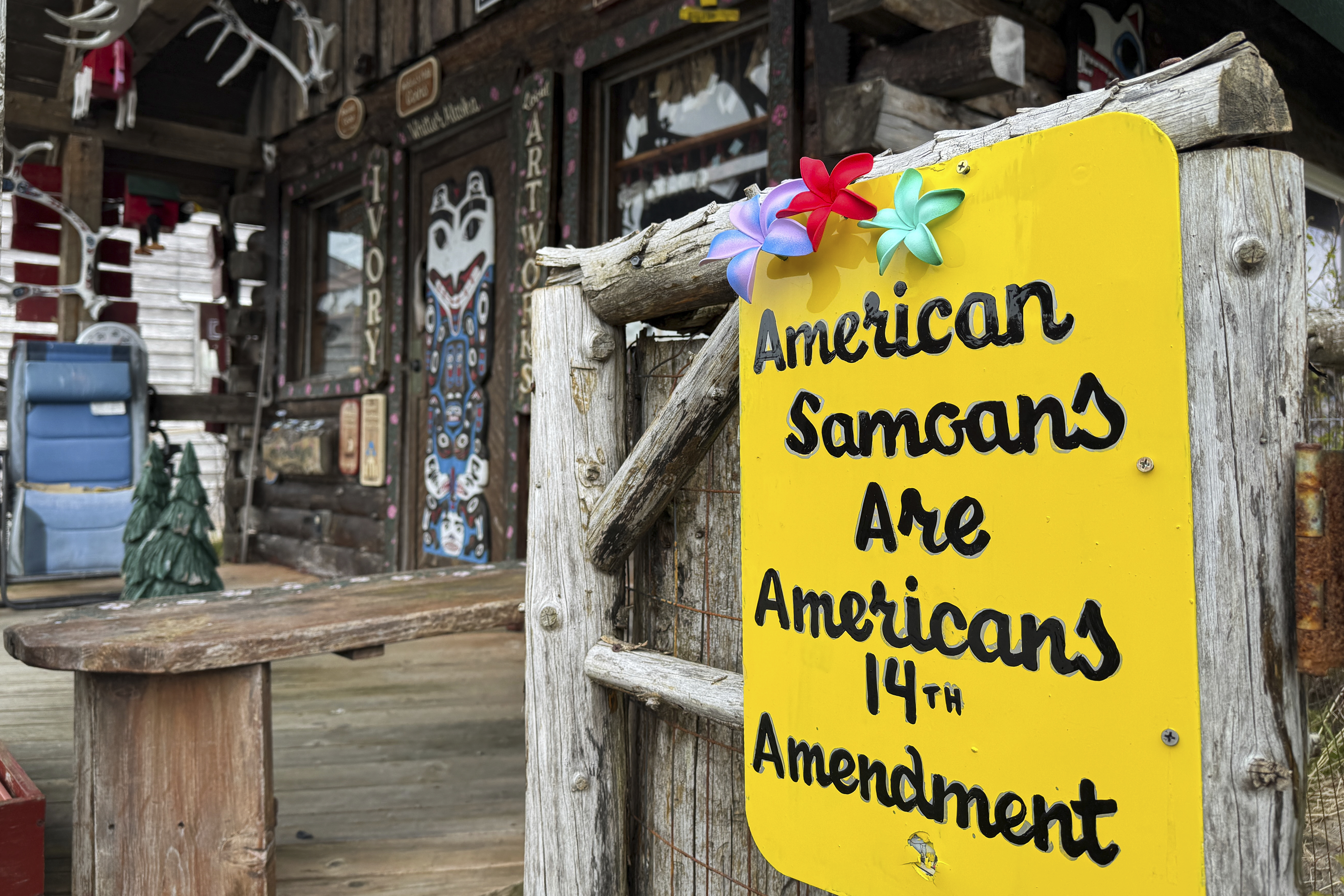 A sign supporting citizenship for American Samoans is posted outside the Log Cabin Gifts store on the waterfront in Whittier, Alaska, May 13, 2025.<br />(Mark Thiessen / AP Photo)