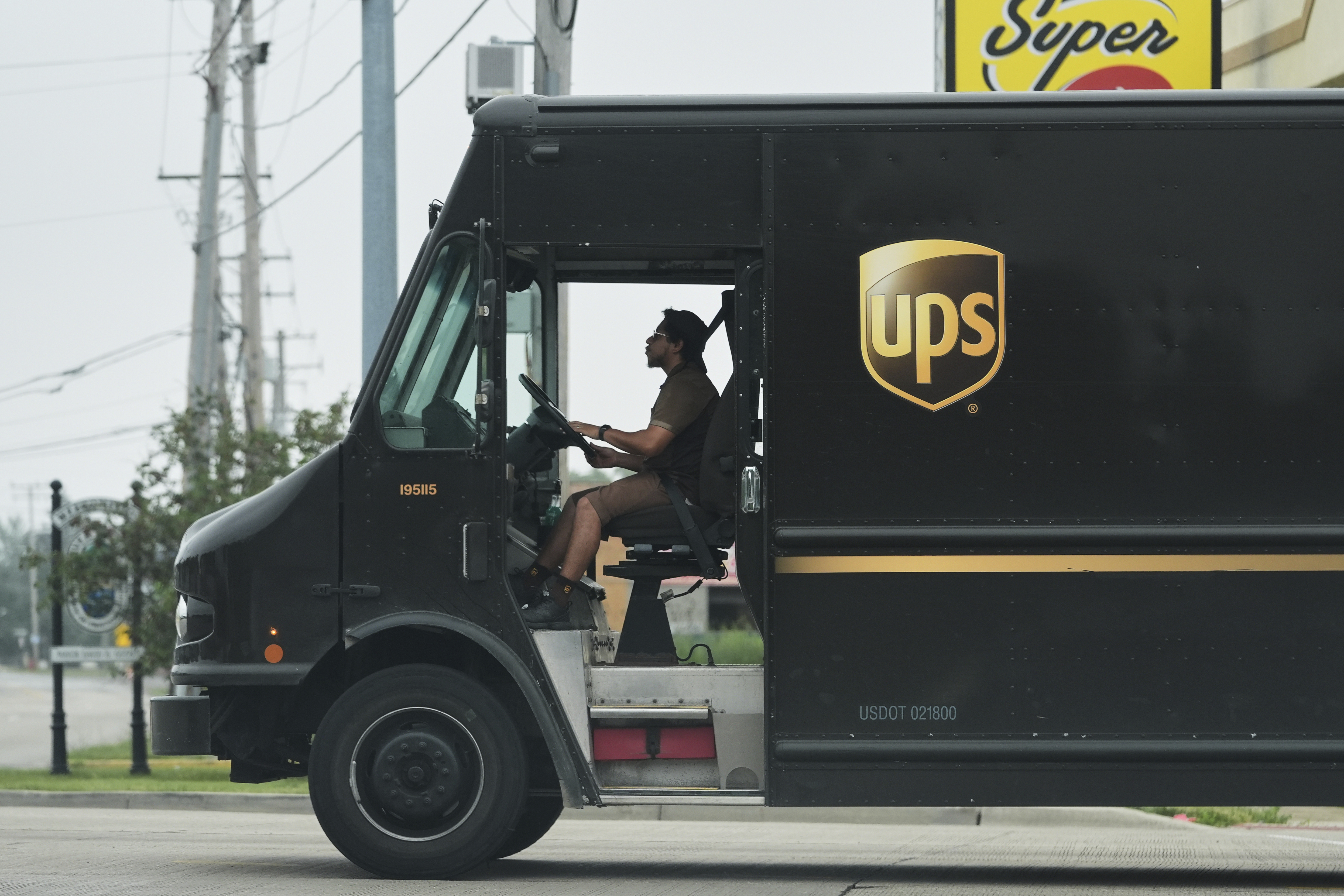 A UPS truck driver makes a delivery Wednesday, June 25, 2025, in River Forest, Ill.<br />(Nam Y. Huh / AP Photo)