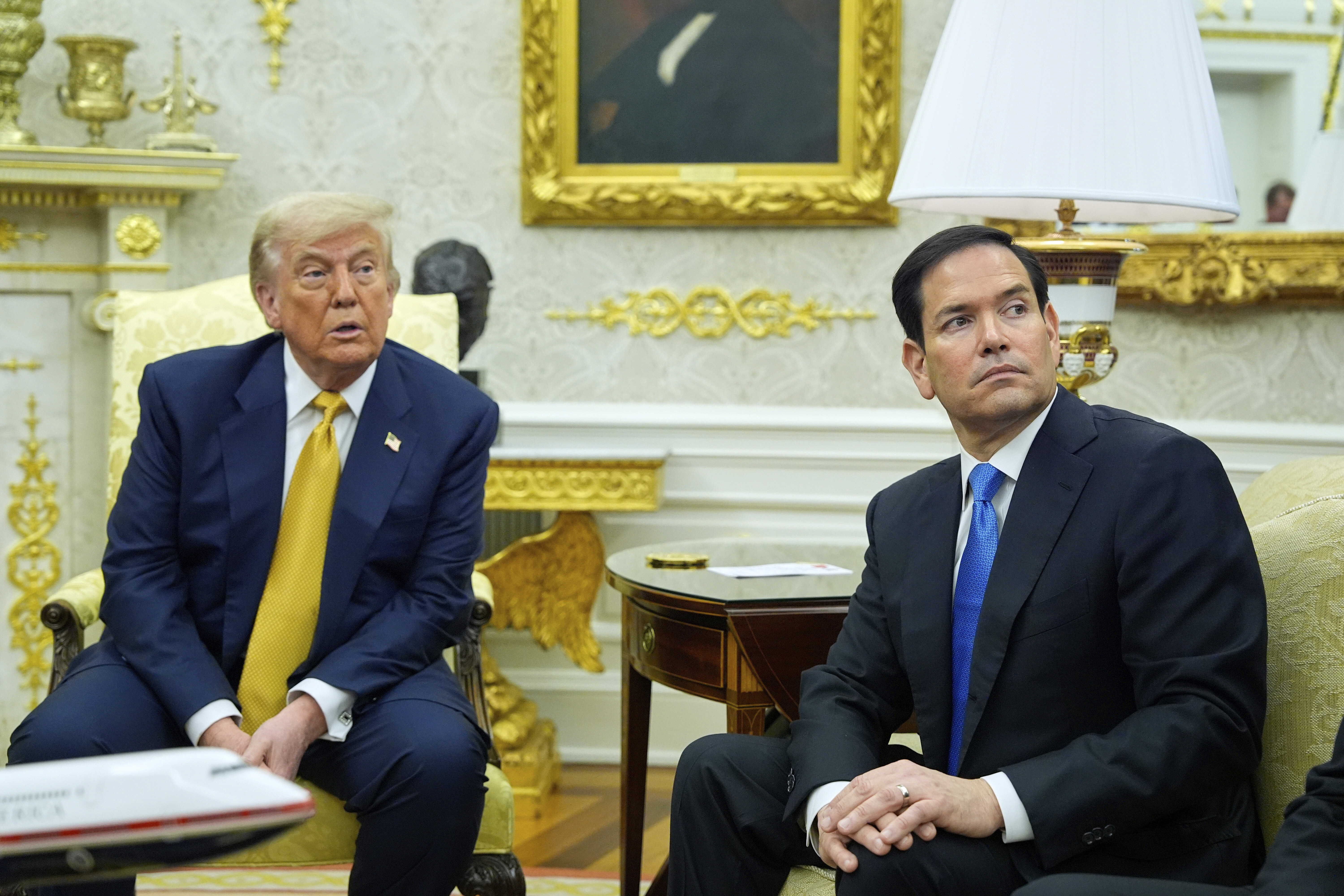 President Donald Trump and Secretary of State Marco Rubio listen during a meeting with Bahrain&#039;s Crown Prince Salman bin Hamad Al Khalifa in the Oval Office of the White House, Wednesday, July 16, 2025, in Washington.<br />(Alex Brandon / AP Photo)