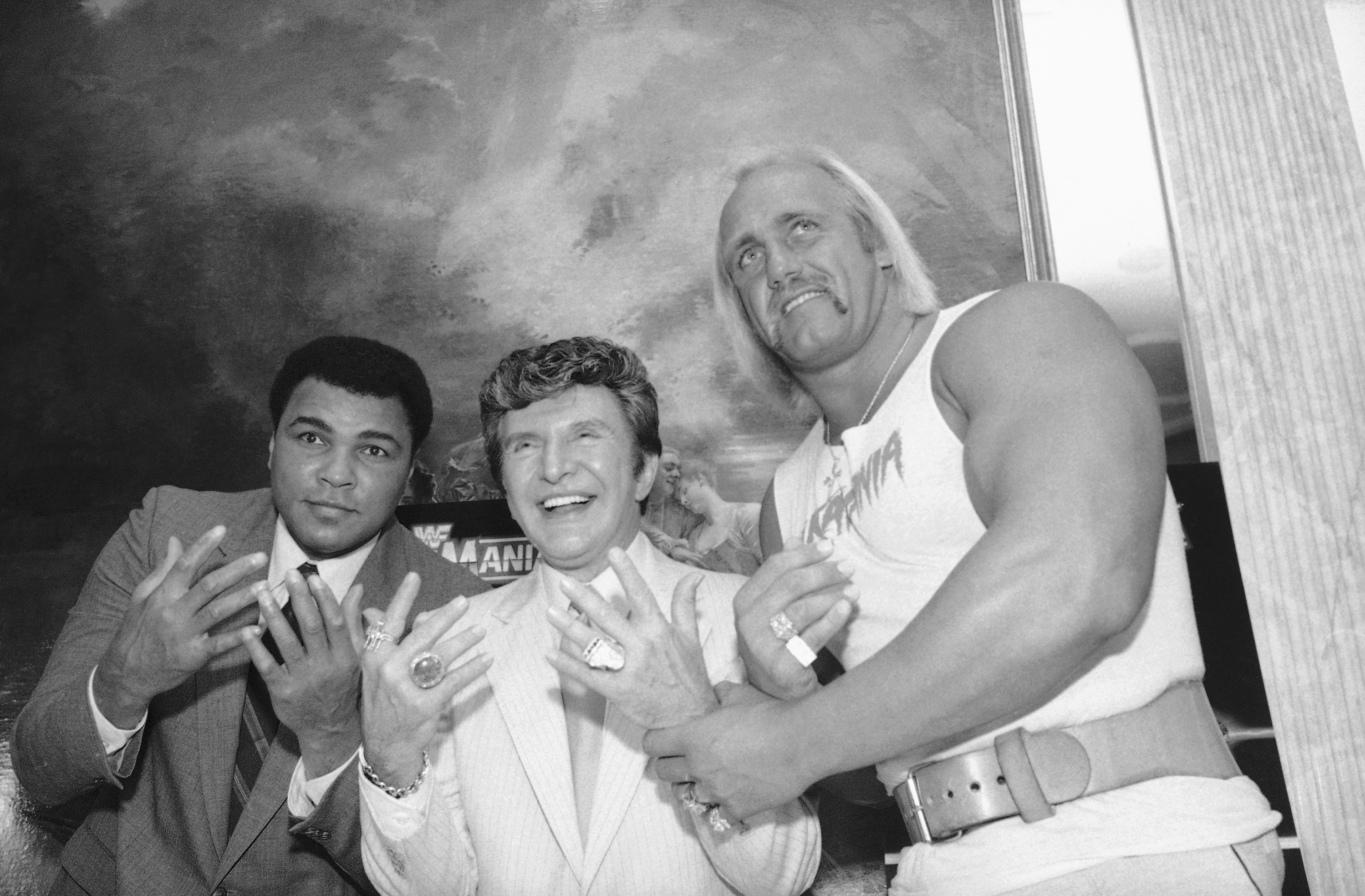 Muhammad Ali (left) Liberace (center) and Hulk Hogan get together at Madison Square Garden in preparation for their upcoming wrestling event, March 29, 1985, in New York. Ali was guest referee and Liberace time keeper when Hulk Hogan and Mr. T, of A-Team fame, were pitted against Rowdy Roddy Piper and Paul (Mr. Wonderful) Orndorff.<br />(Marty Lederhandler / AP Photo)