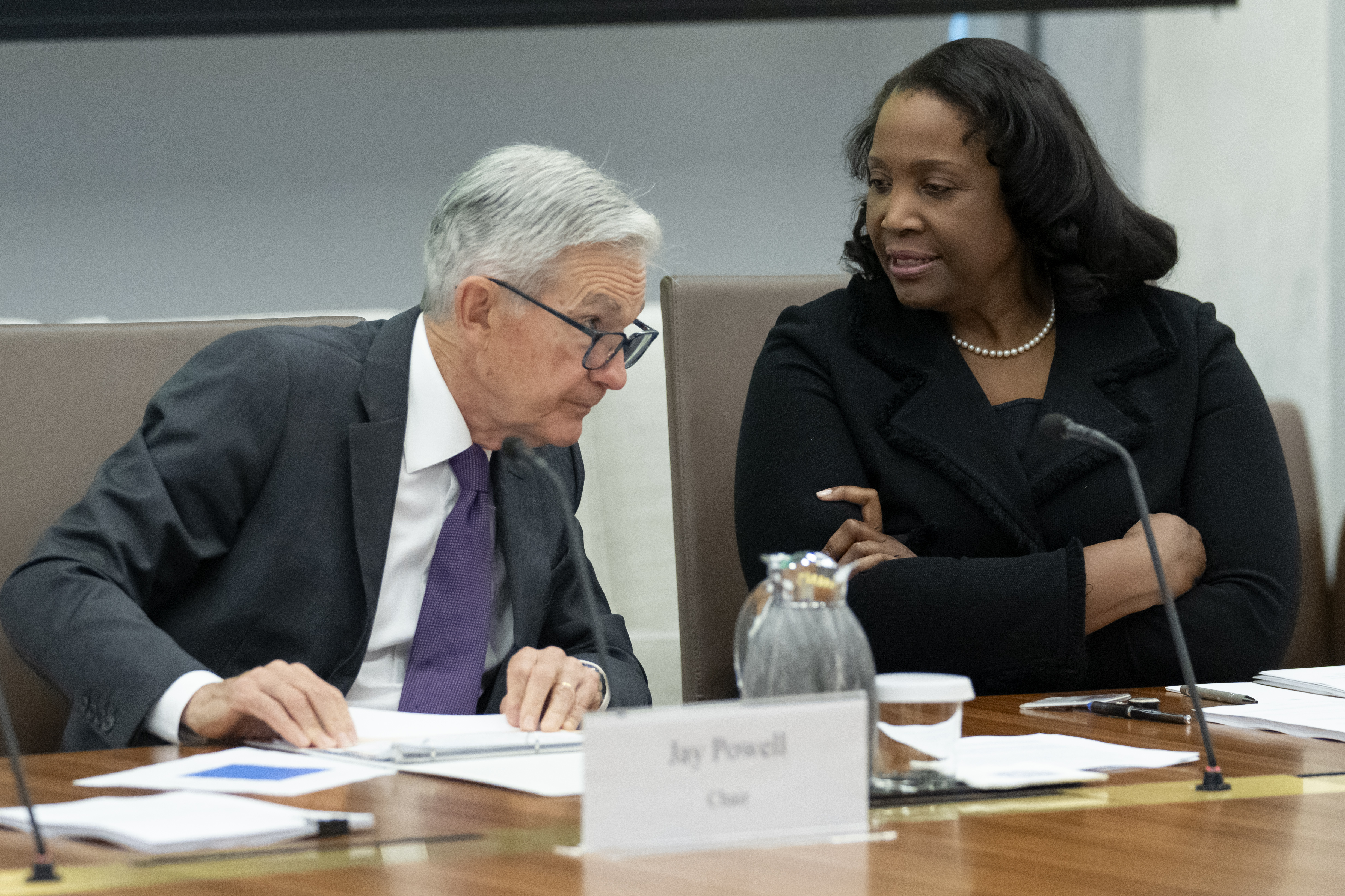 Federal Reserve Chairman Jerome Powell (left)talks with Board of Governors member Lisa Cook (right) during an open meeting of the Board of Governors at the Federal Reserve, June 25, 2025, in Washington.<br />(Mark Schiefelbein / AP Photo)