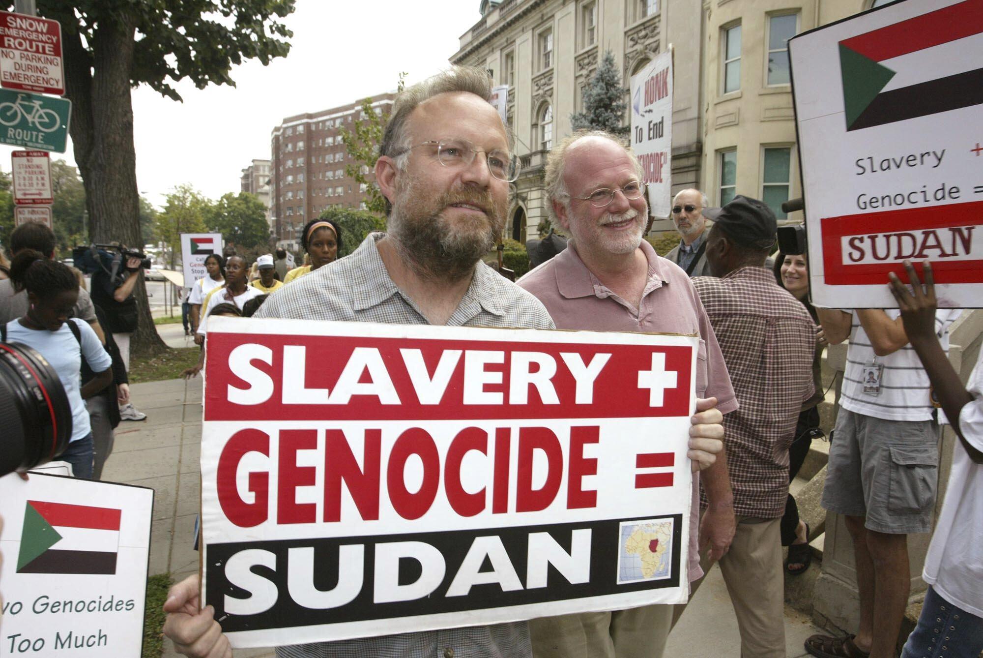 Founders of Ben &amp; Jerry&#039;s Ice Cream, Jerry Greenfield  (left) and Ben Cohen (right), protest in front of Sudan&#039;s embassy July 29, 2004, in Washington.<br />(Charles Dharapak / AP Photo)
