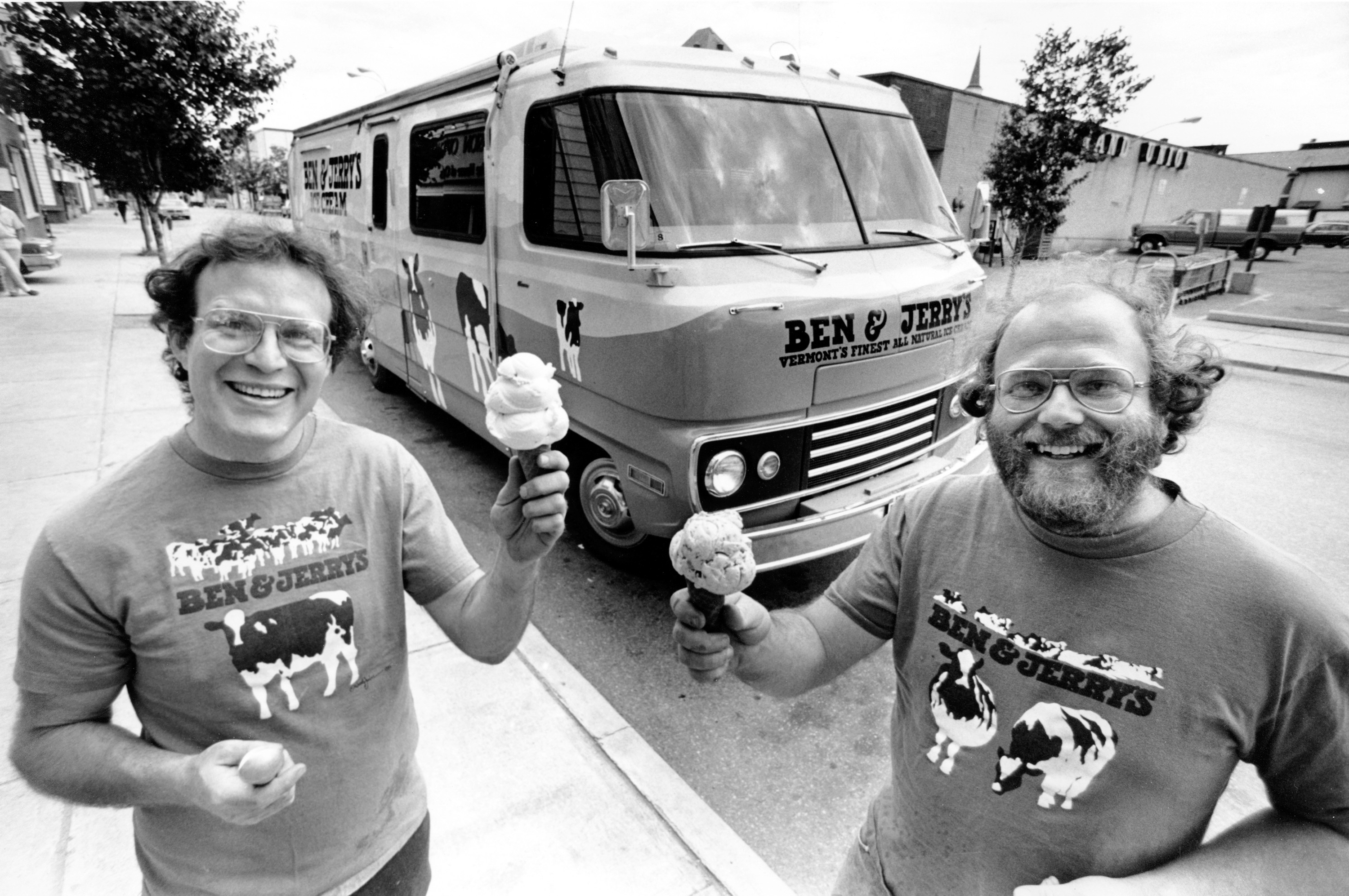 Jerry Greenfield (left) and Bennett Cohen (right), the founders of Ben and Jerry Homemade Inc., pose in front of their &quot;Cowmobile&quot; in Burlington, Vt., on June 15, 1987.<br />(Toby Talbot / AP Photo)