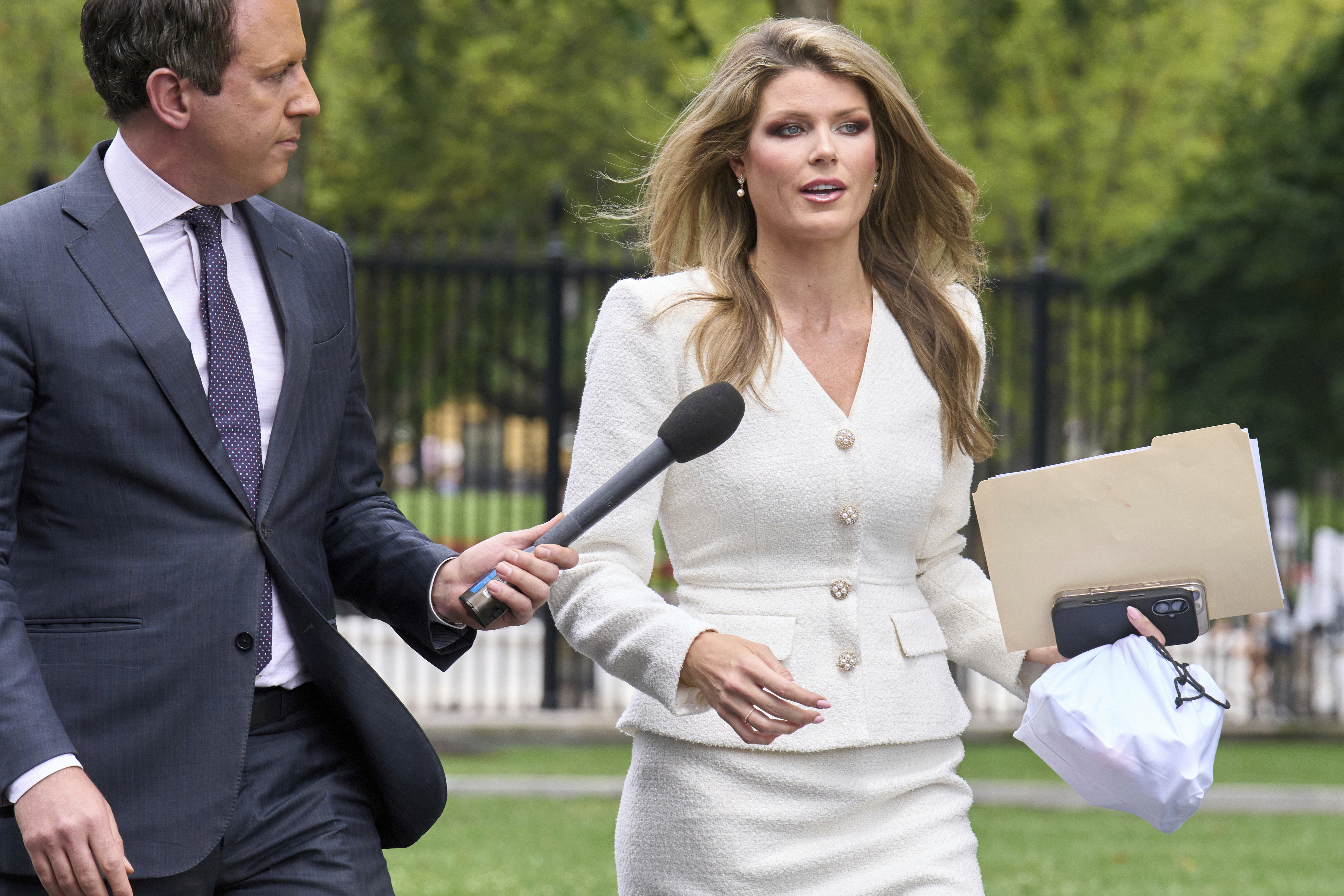 Lindsey Halligan, special assistant to the president, speaks with a reporter outside of the White House, Wednesday, Aug. 20, 2025, in Washington.<br />(Jacquelyn Martin / AP Photo)