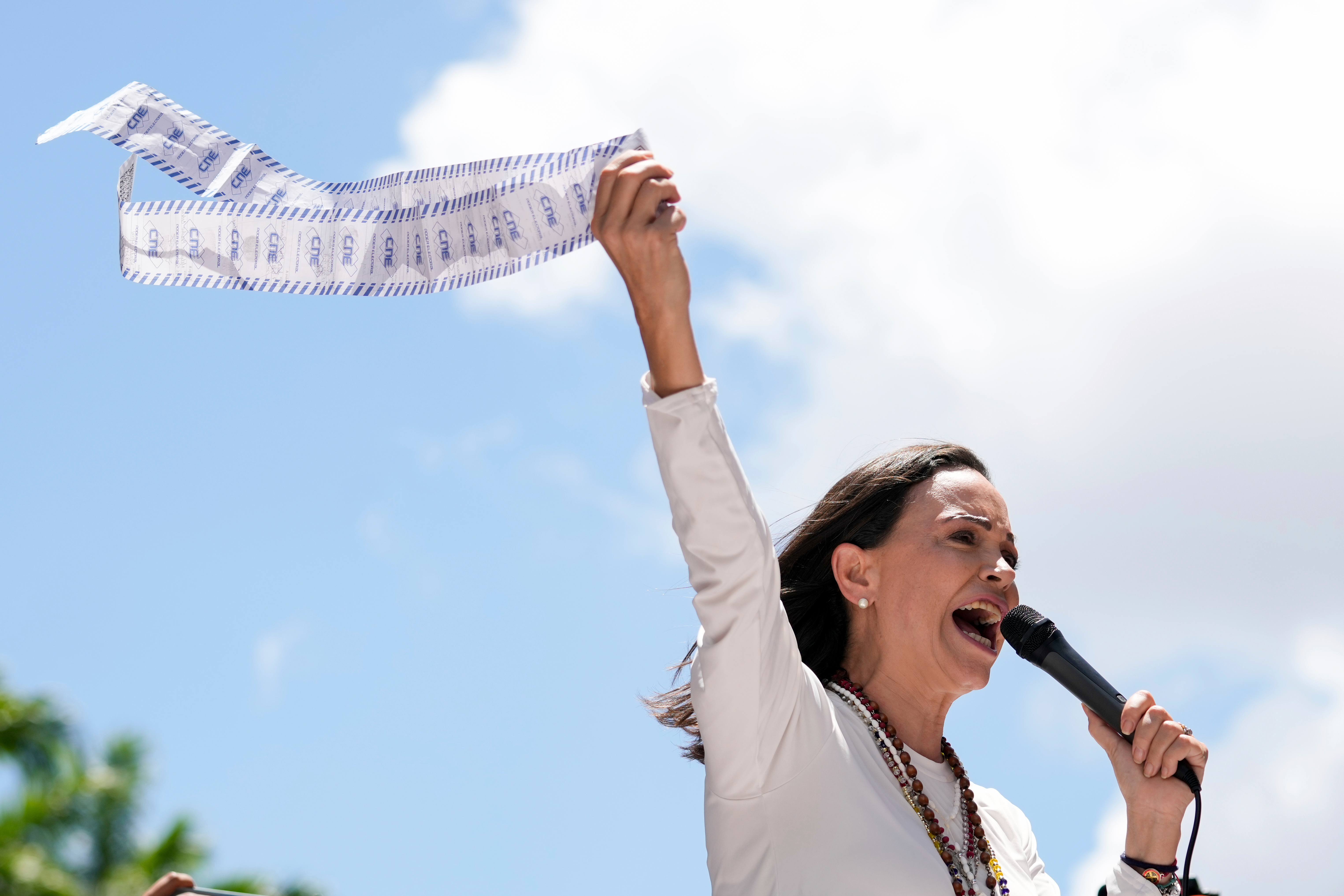 Opposition leader Maria Corina Machado holds up tally sheets during a protest against the reelection of President Nicolás Maduro one month after the disputed presidential vote which she says the opposition won by a landslide, in Caracas, Venezuela, Aug. 28, 2024.<br />(Ariana Cubillos / AP Photo)