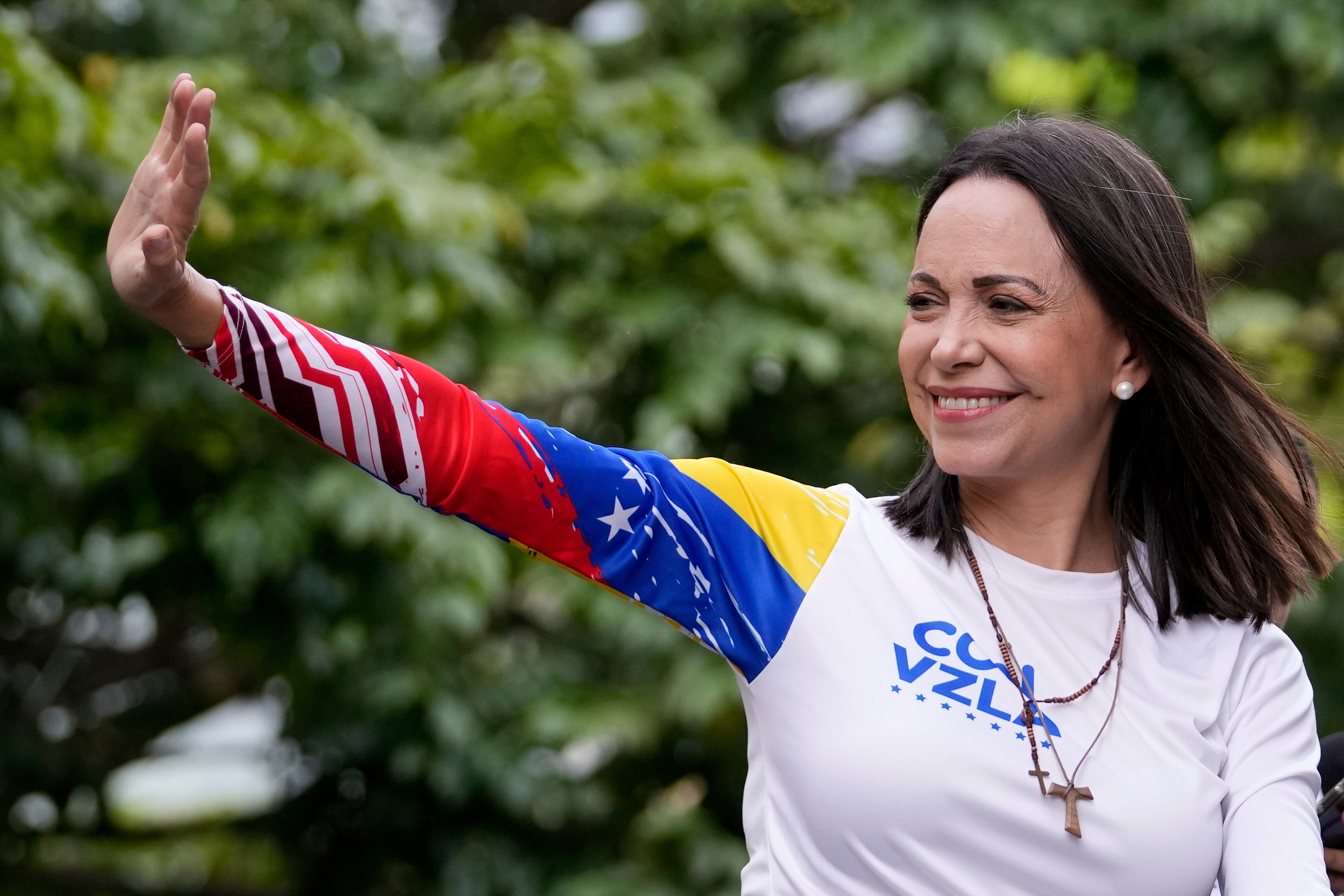 Opposition leader Maria Corina Machado waves from atop a truck during the closing election campaign rally for presidential candidate Edmundo Gonzalez in Caracas, Venezuela, Thursday, July 25, 2024.<br />(Matias Delacroix / AP Photo)