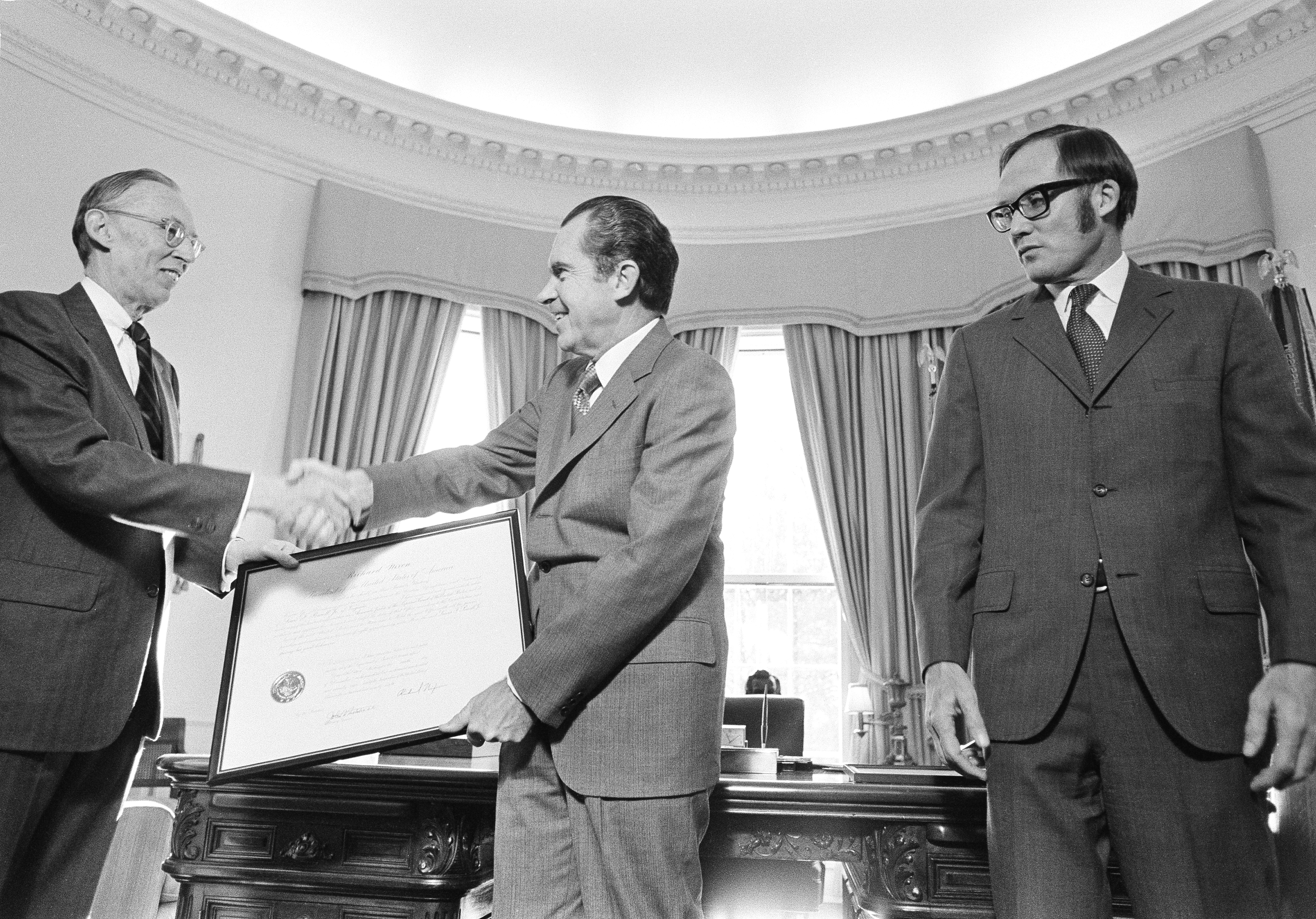 U.S. President Richard Nixon presents to Lewis F. Powell, Jr. a framed commission as an Associate Justice of the Supreme Court during a ceremony at the White House in Washington, D.C., Wednesday, Dec. 22, 1971.<br /> (Henry Burroughs / AP Photo)