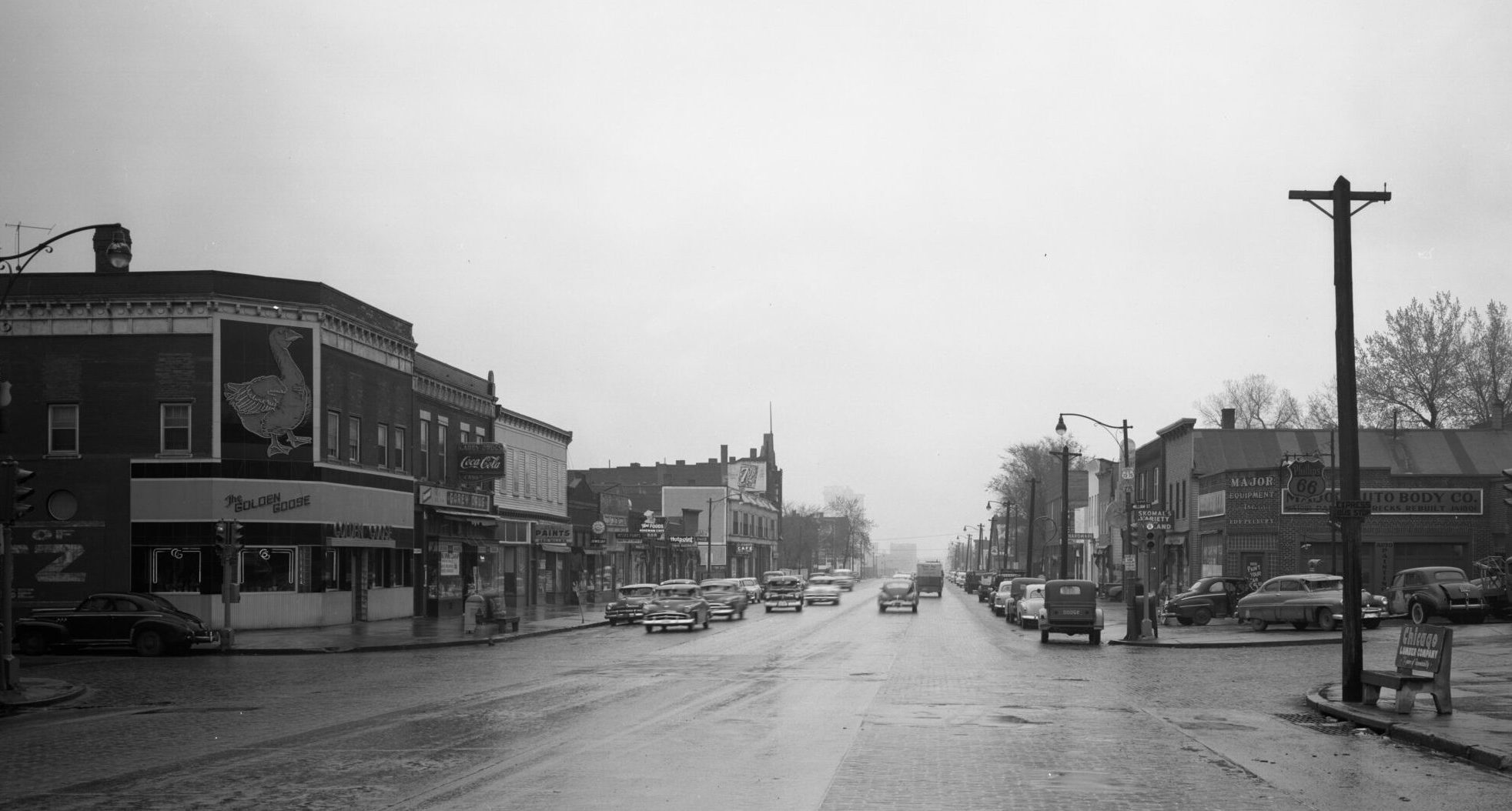 Vintage photo looking north toward downtown Omaha from South 13th and William Streets. At left-front is 1890 building when it housed the Golden Goose bar and restaurant. It is to be rehabilitated as part of the Little Bo Village project proposed by Clarity Development.<br />(Courtesy of KMTV \ Bostwick-Frohardt collection, housed at Durham Museum)