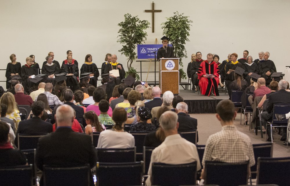 Nathaniel Griggs delivers the valedictory address June 8, 2013, during the Trinity School commencement ceremony inside the People of Praise Community Center in South Bend, Ind.         (Robert Franklin/South Bend Tribune via AP)