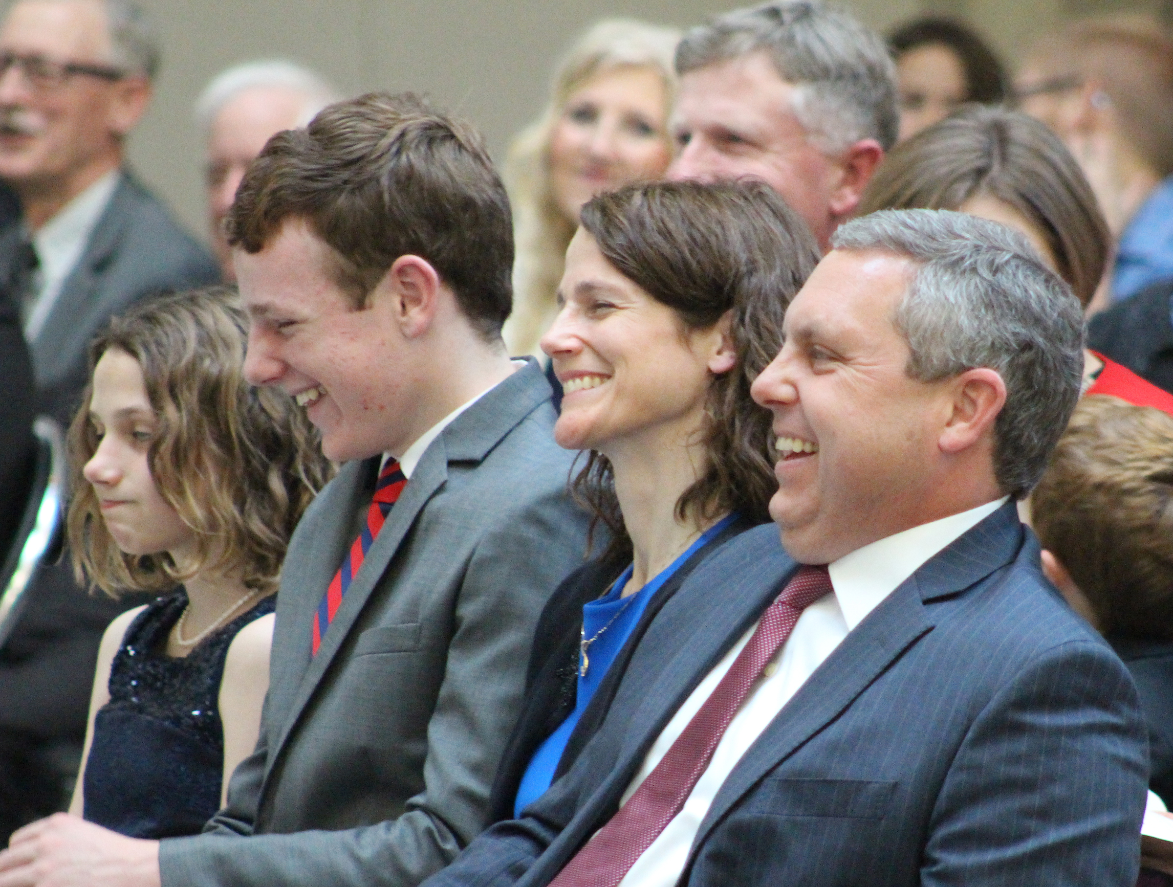 Brian C. Buescher laughs during U.S. Sen. Ben Sasse&#039;s remarks during his investiture ceremony at the Hruska Federal Courthouse on Friday, Nov. 15, 2019. (Photo by Scott Stewart)