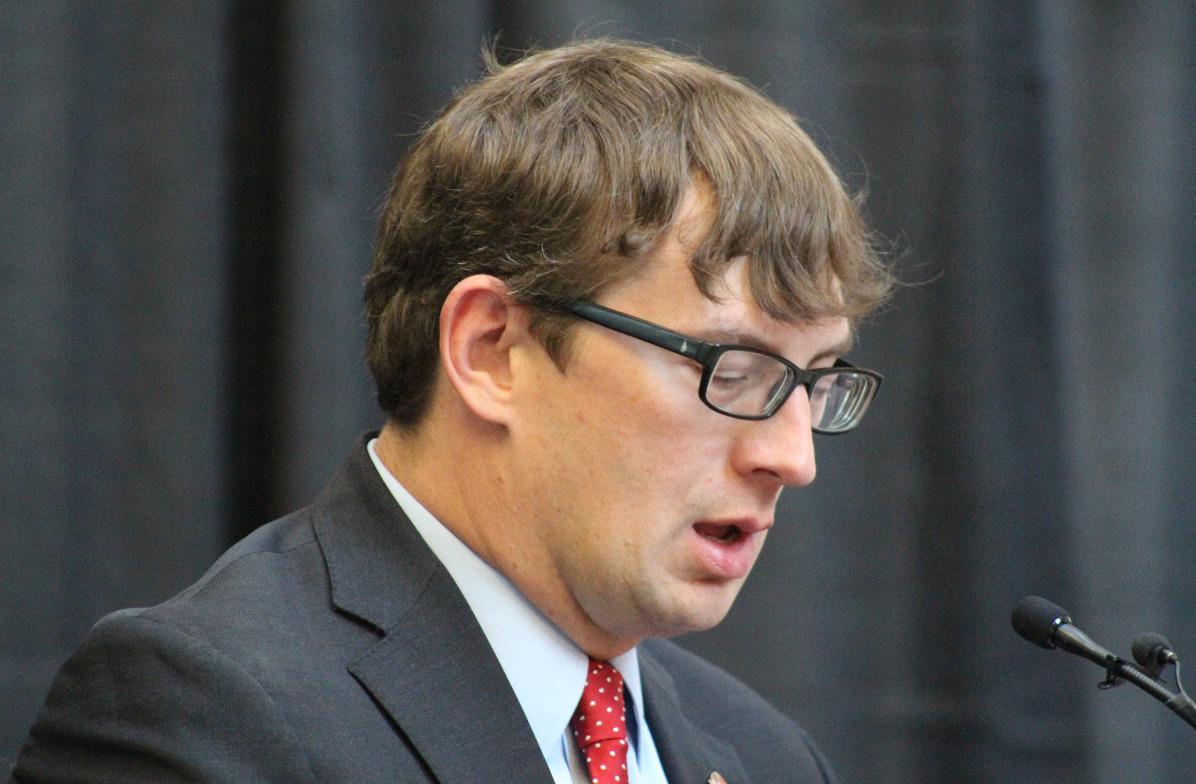 Chad W. Pekron, an attorney at Wuattlebaum, Grooms &amp; Tull PLLC of Little Rock, Arkansas, reads the presidential commission during Brian C. Buescher&#039;s investiture ceremony at the Hruska Federal Courthouse on Friday, Nov. 15, 2019. (Photo by Scott Stewart)