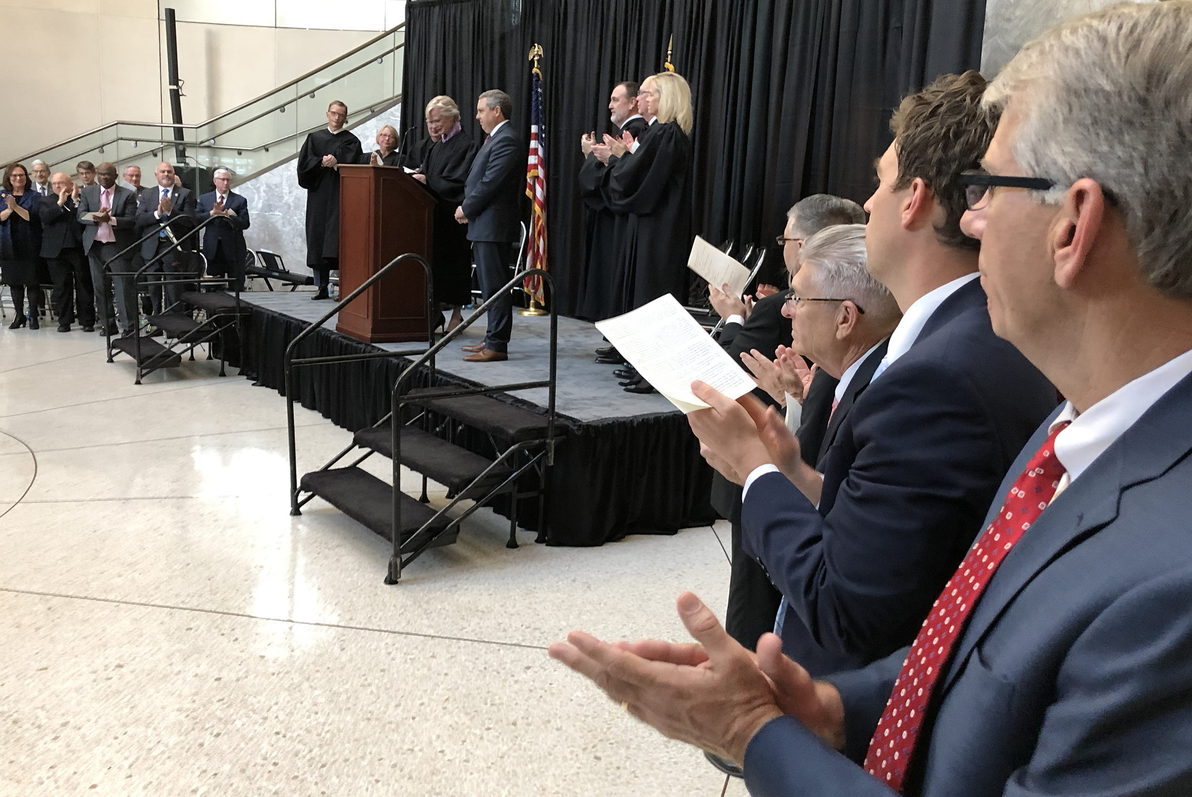 Brian C. Buescher receives applause during his investiture ceremony at the Hruska Federal Courthouse on Friday, Nov. 15, 2019. (Photo by Scott Stewart)