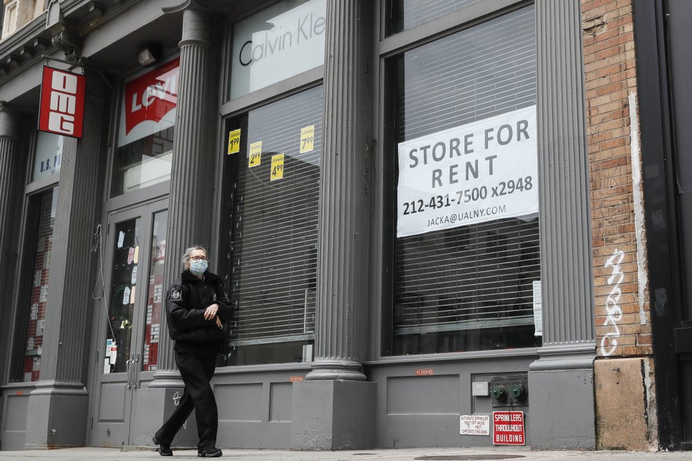 A pedestrian passes a storefront available for rent on Broadway south of Canal Street in the Manhattan borough of New York on April 27, 2020. Many businesses devastated by the pandemic are expected to abandon offices and storefronts. The changes are happening because more employees are working from home, and more people are shopping online. (AP)