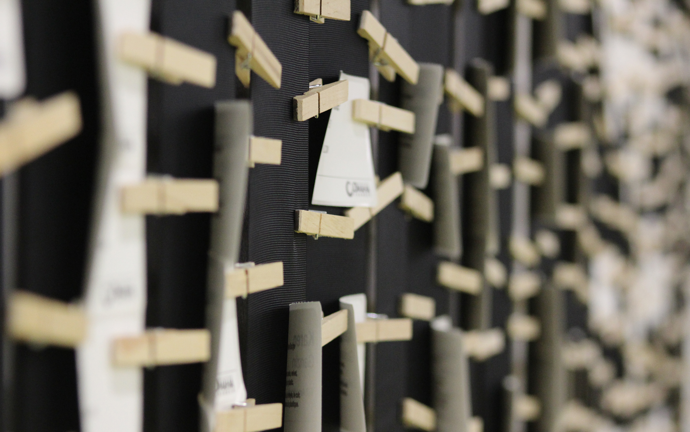 Columns of name tags were affixed to a wall using cloth pins at the Greater Omaha Chamber offices on Thursday, Dec. 5, 2019. (Photo by Scott Stewart)